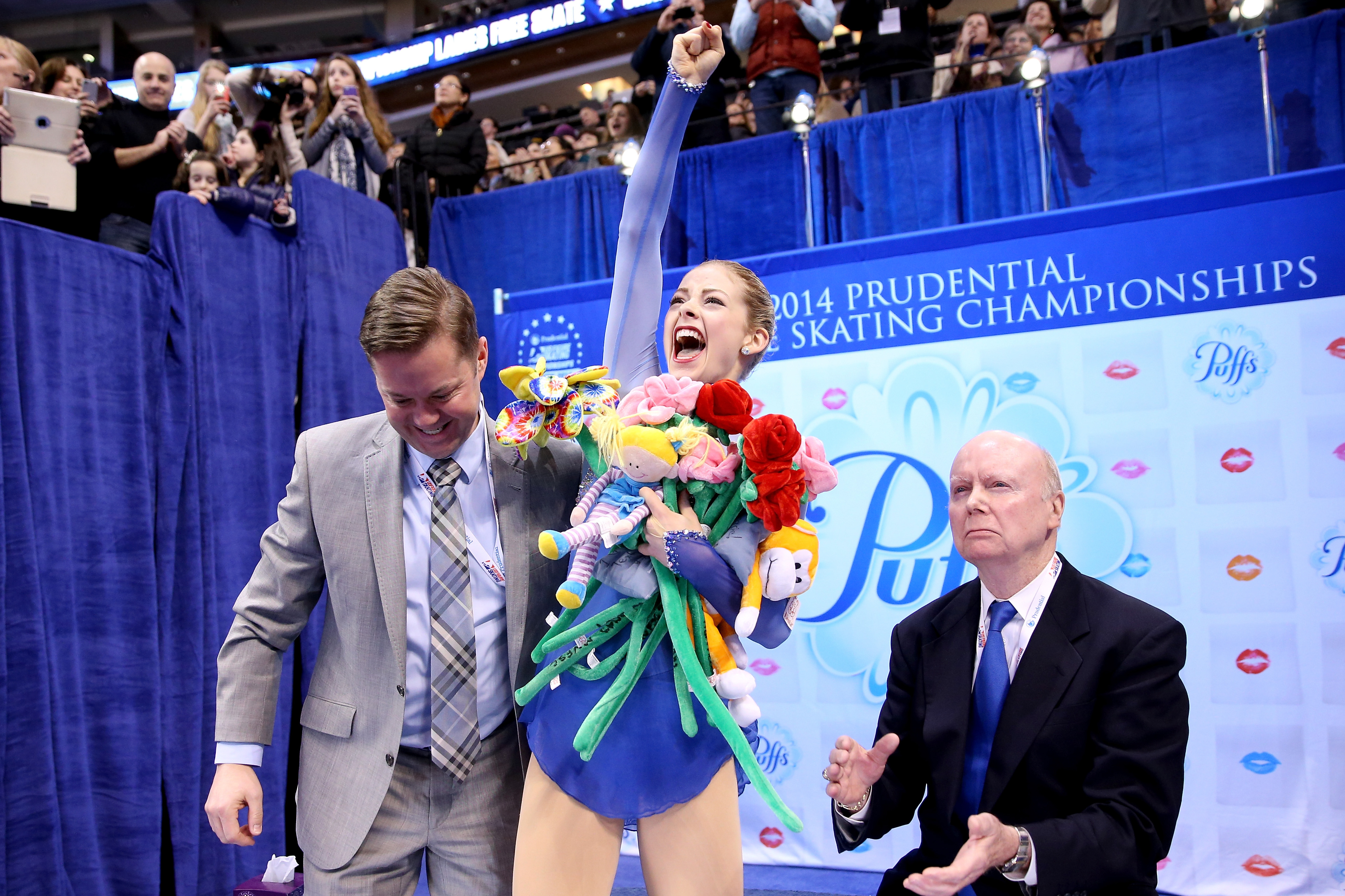 BOSTON, MA - JANUARY 11:  Gracie Gold, with her coaches Scott Brown and Frank Carroll, celebrates in the kiss and cry after skating in the ladies free skate during the Prudential U.S. Figure Skating Championships at TD Garden on January 11, 2014 in Boston, Massachusetts.  (Photo by Matthew Stockman/Getty Images)