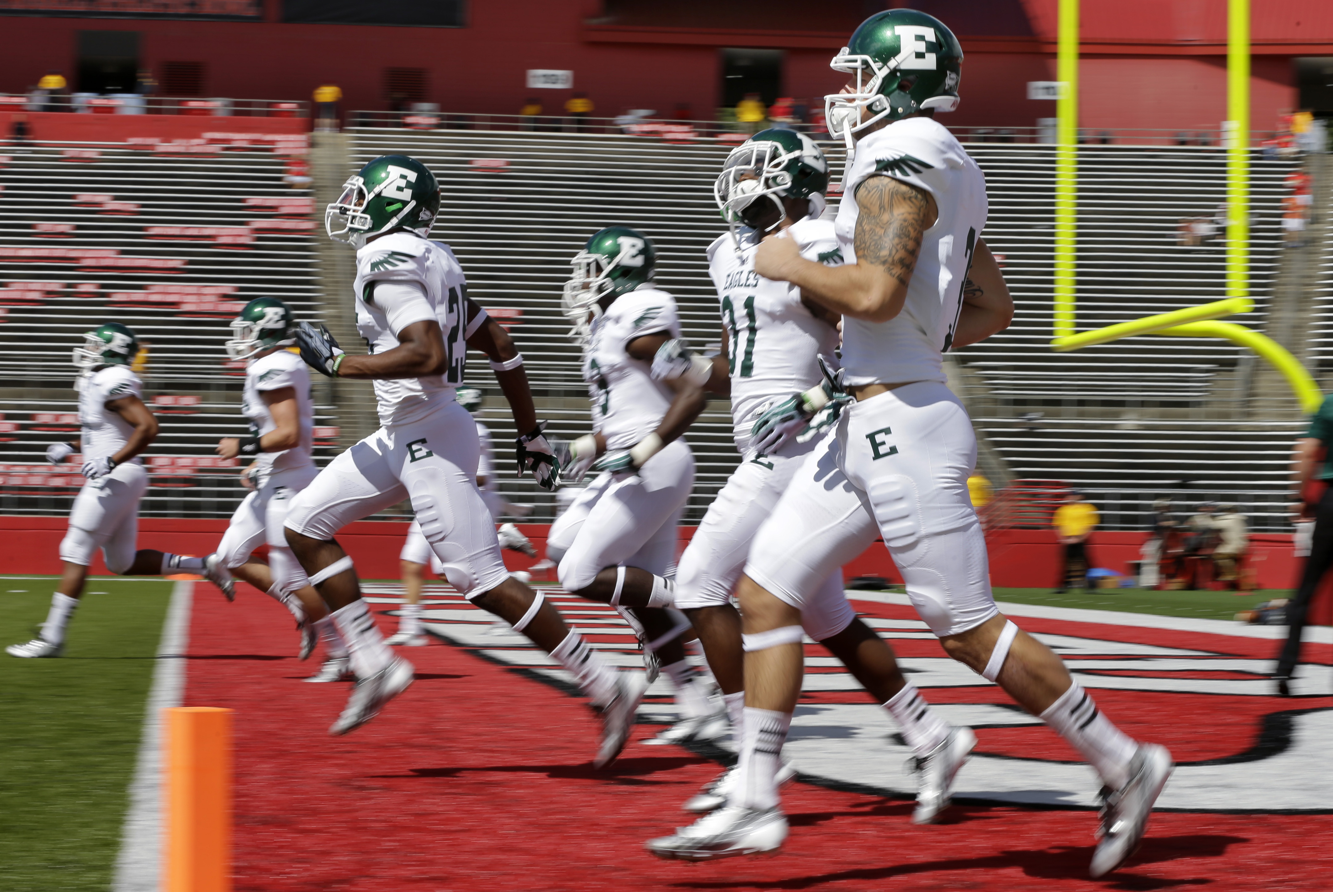 Eastern Michigan players warm-up before an NCAA college football game against Rutgers  in Piscataway, N.J., Satuday, Sept. 14, 2013. (AP Photo/Mel Evans)