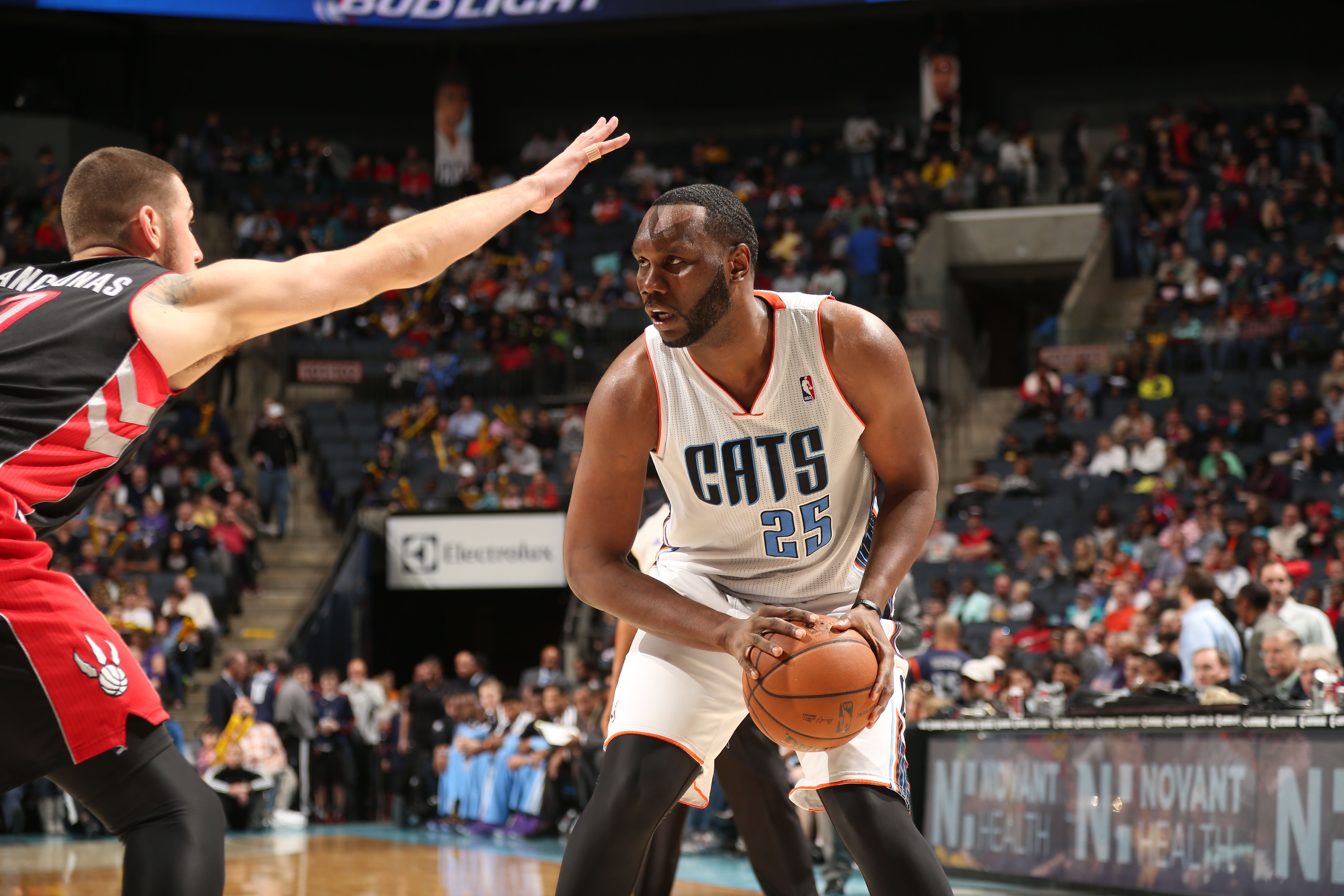 CHARLOTTE, NC - JANUARY 20:  Al Jefferson #25 of the Charlotte Bobcats controls the ball against Jonas Valanciunas #17 of the Toronto Raptors during the game at the Time Warner Cable Arena on January 20, 2014 in Charlotte, North Carolina.  NOTE TO USER: User expressly acknowledges and agrees that, by downloading and or using this photograph, User is consenting to the terms and conditions of the Getty Images License Agreement.  Mandatory Copyright Notice:  Copyright 2014 NBAE (Photo by Brock Williams-Smith/NBAE via Getty Images)