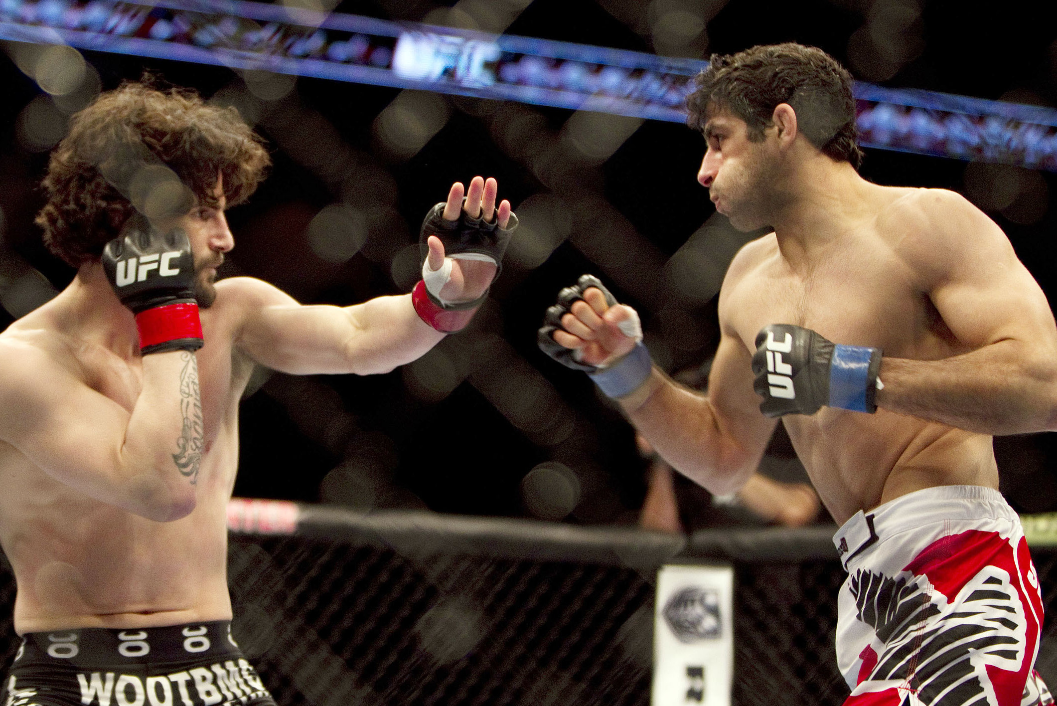 Jan 15, 2014; Duluth, GA, USA; Charlie Brenneman(red gloves) fights Beneil Dariush (blue gloves) during UFC Fight Night at Gwinnett Center. Dariush won. Mandatory Credit: Joshua S. Kelly-USA TODAY Sports