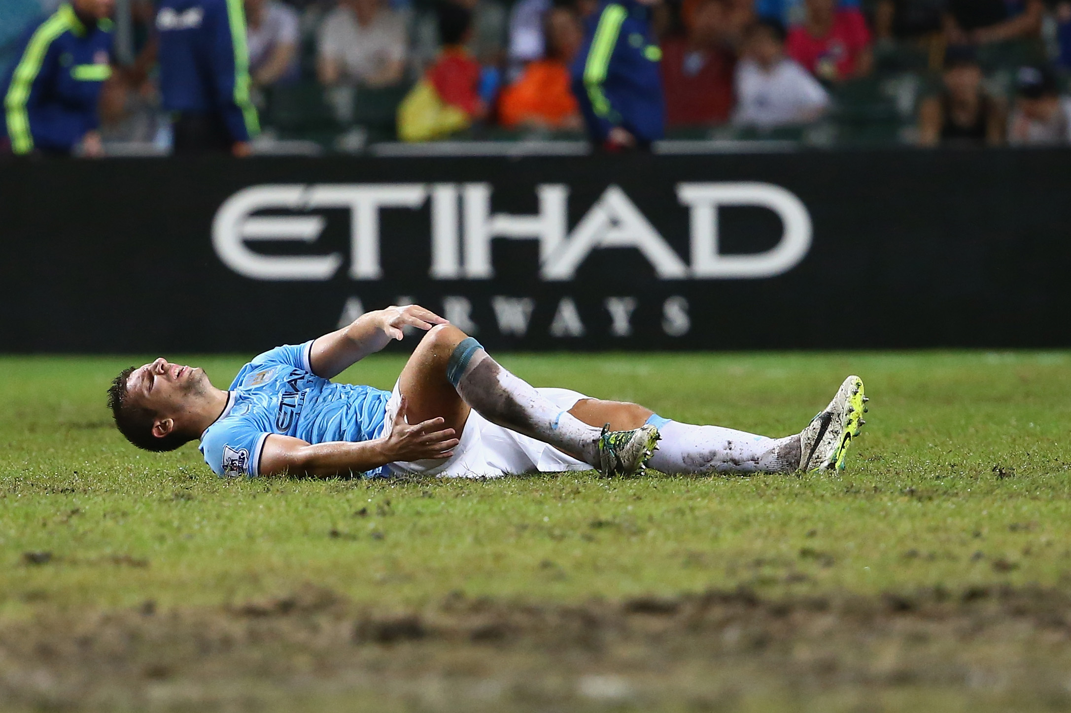 SO KON PO, HONG KONG - JULY 27:  Matija Nastasic of Mancester City suffers an injury during the Barclays Asia Trophy Final match between Manchester City and Sunderland at Hong Kong Stadium on July 27, 2013 in So Kon Po, Hong Kong.  (Photo by Robert Cianflone/Getty Images)