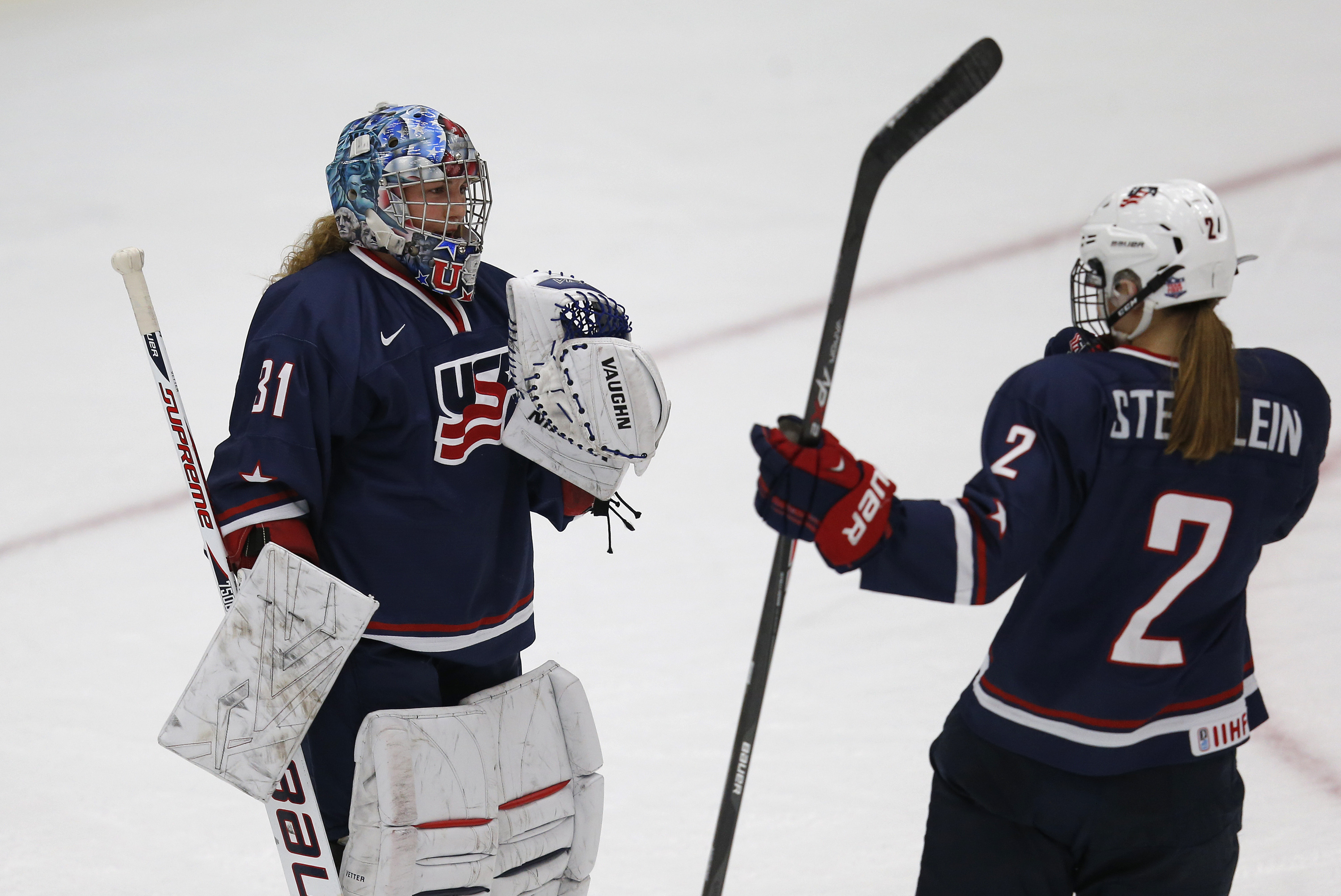 CALGARY, CANADA - DECEMBER 12: Team USA's goalie Jessie Vetter #31 and teammate Lee Stecklein #2 celebrate their win over Canada during their National Women's Team Series December 12, 2013 in Calgary, Alberta, Canada. (Photo by Todd Korol/Getty Images)