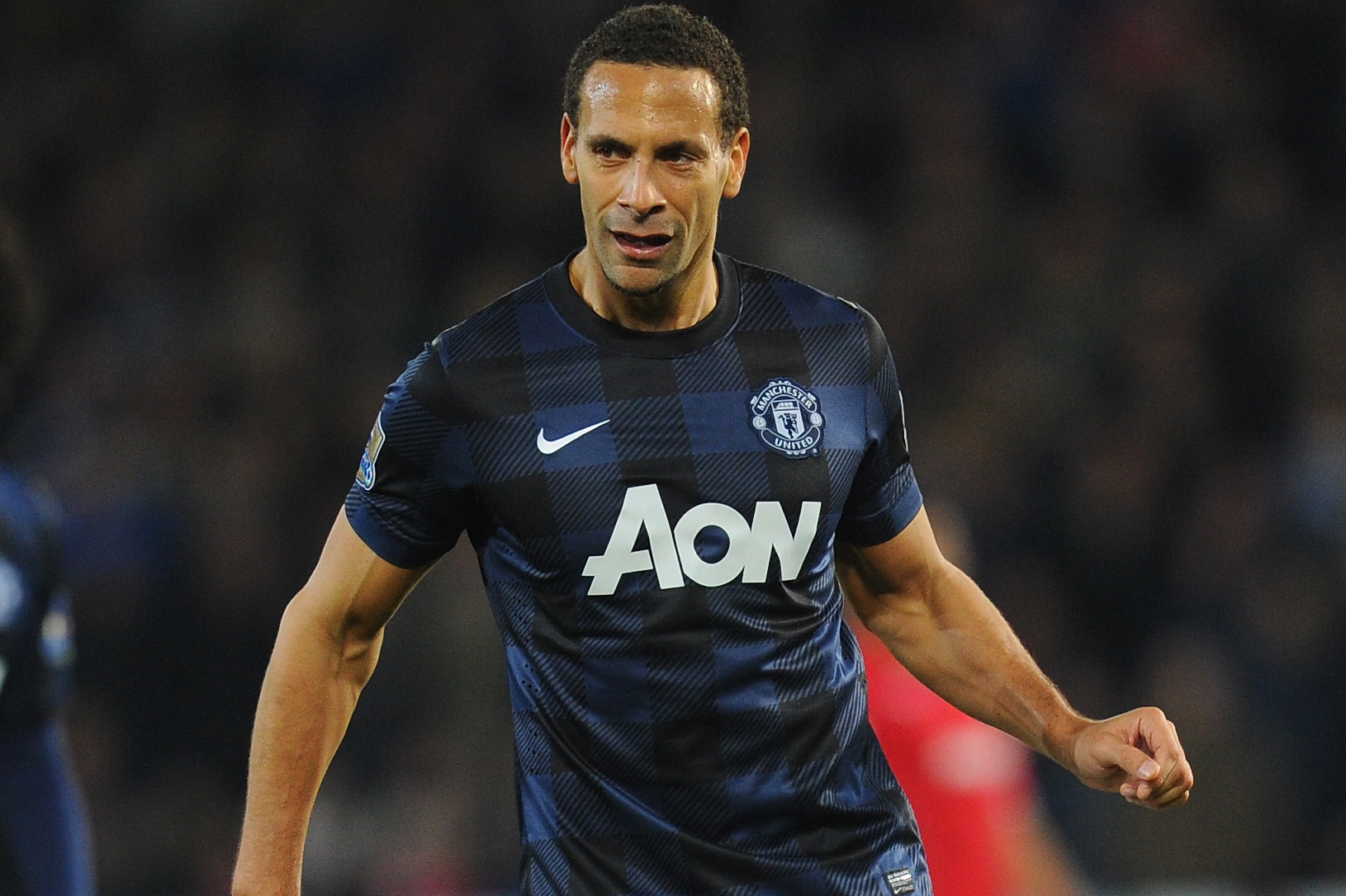 CARDIFF, WALES - NOVEMBER 24:  Manchester United player Rio Ferdinand in action during the Barclays Premier League match between Cardiff City and Manchester United at Cardiff City Stadium on November 24, 2013 in Cardiff, Wales.  (Photo by Stu Forster/Getty Images)