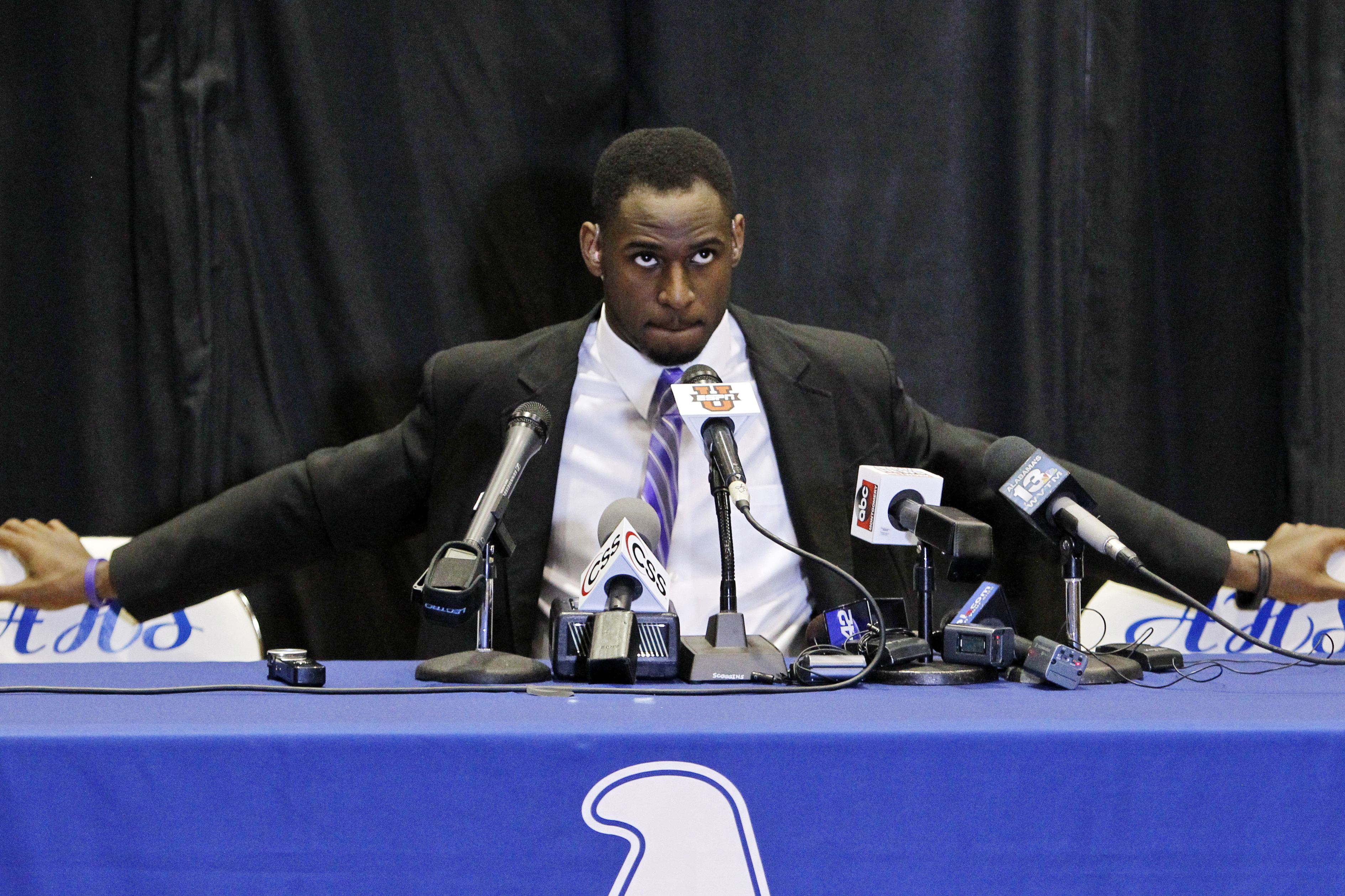 Rashaan Evans sits and waits for ESPN to go live before announcing his commitment during national Signing Day on Wednesday, Feb. 5, 2014, in Auburn, Ala. The Auburn High School football player announced that he will attend Alabama. (AP Photo/Butch Dill)