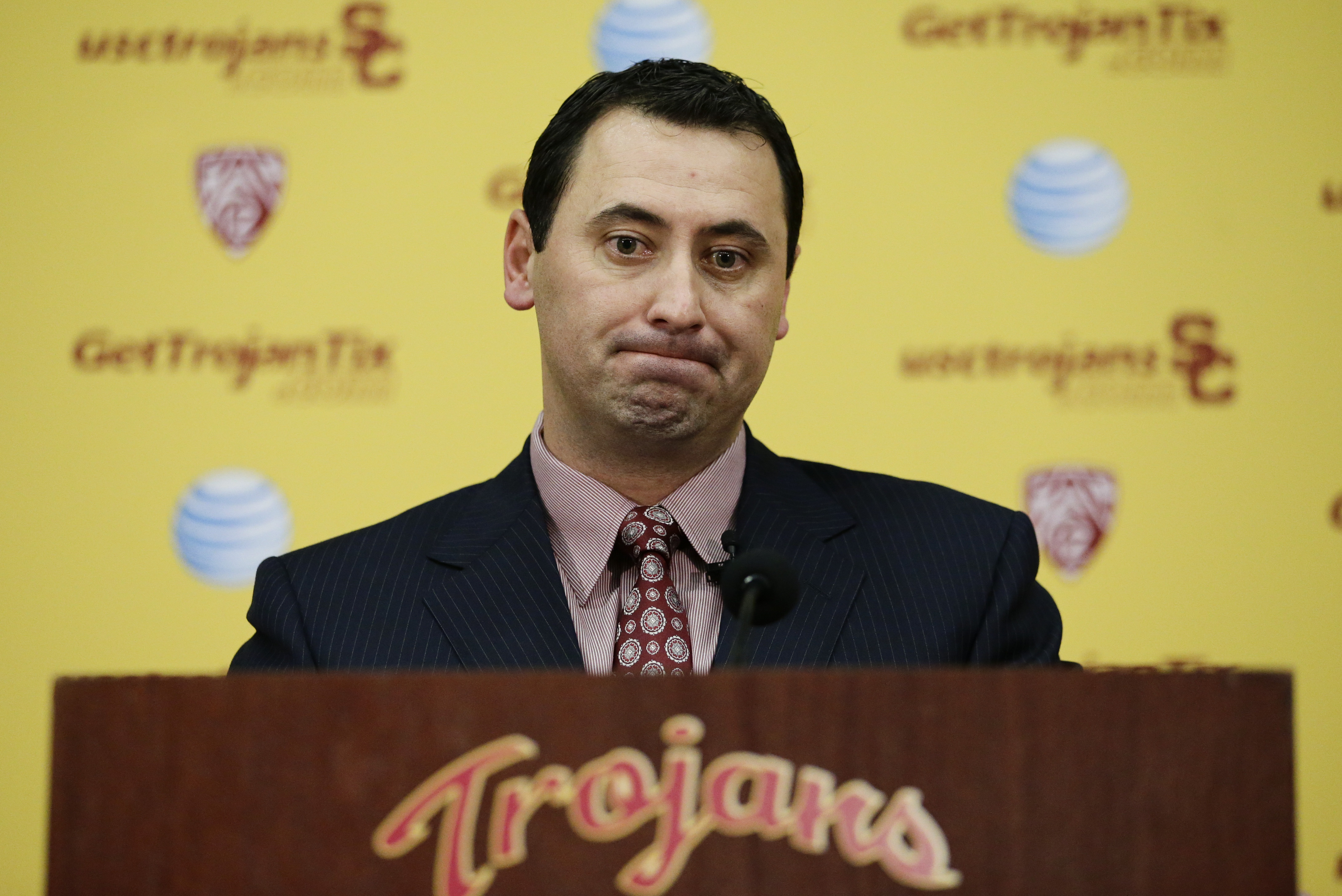 New Southern California football head coach Steve Sarkisian pauses for a moment during a news conference on Tuesday, Dec. 3, 2013, in Los Angeles. USC hired Sarkisian away from Washington on Monday, bringing back the former Trojans offensive coordinator to his native Los Angeles area and the storied program where he thrived as Pete Carroll's assistant. (AP Photo/Jae C. Hong)