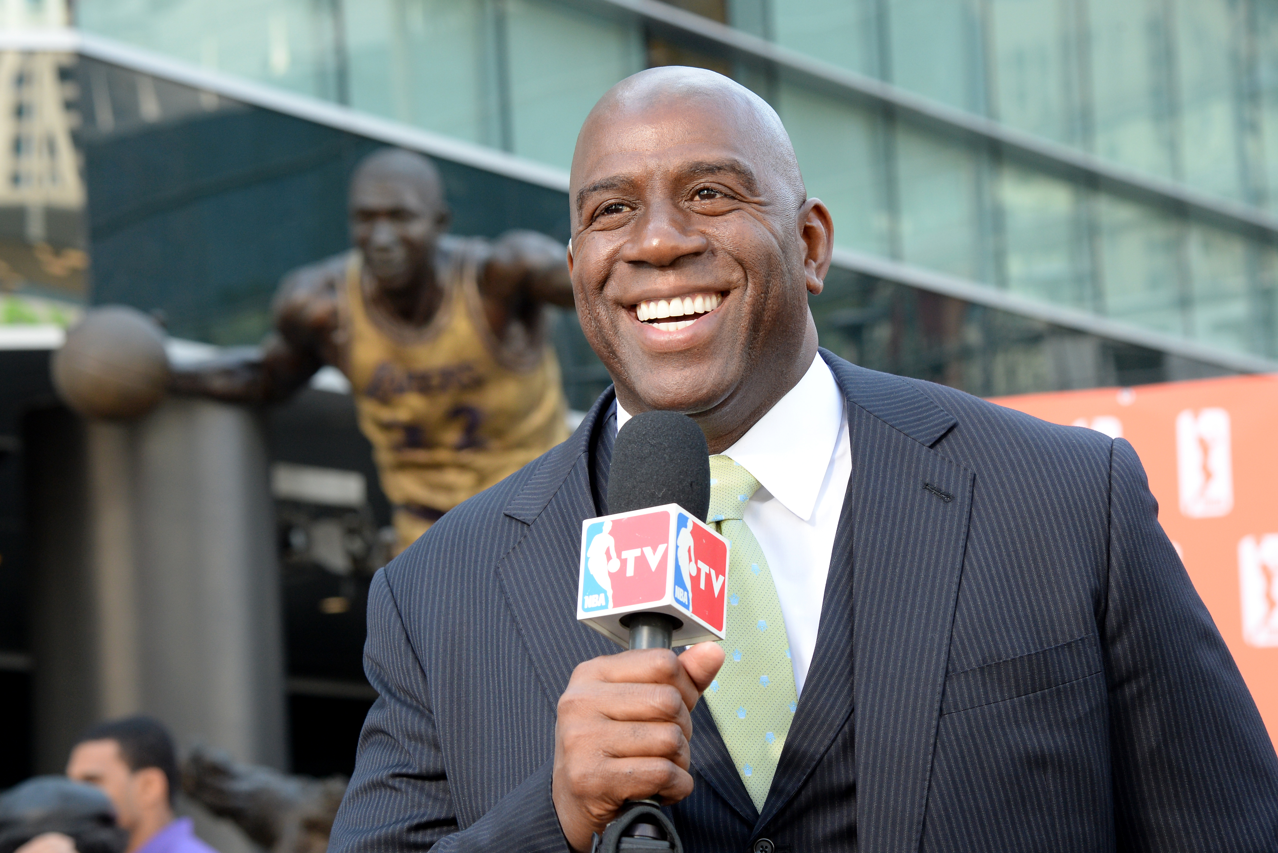 LOS ANGELES, CA - FEBRUARY 5:  Earvin 'Magic' Johnson poses for a picture during a press conference to announce his purchase of the Los Angeles Sparks at STAPLES Center on February 5, 2014 in Los Angeles, California. NOTE TO USER: User expressly acknowledges and agrees that, by downloading and/or using this Photograph, user is consenting to the terms and conditions of the Getty Images License Agreement. Mandatory Copyright Notice: Copyright 2014 NBAE (Photo by Andrew D. Bernstein/NBAE via Getty Images)