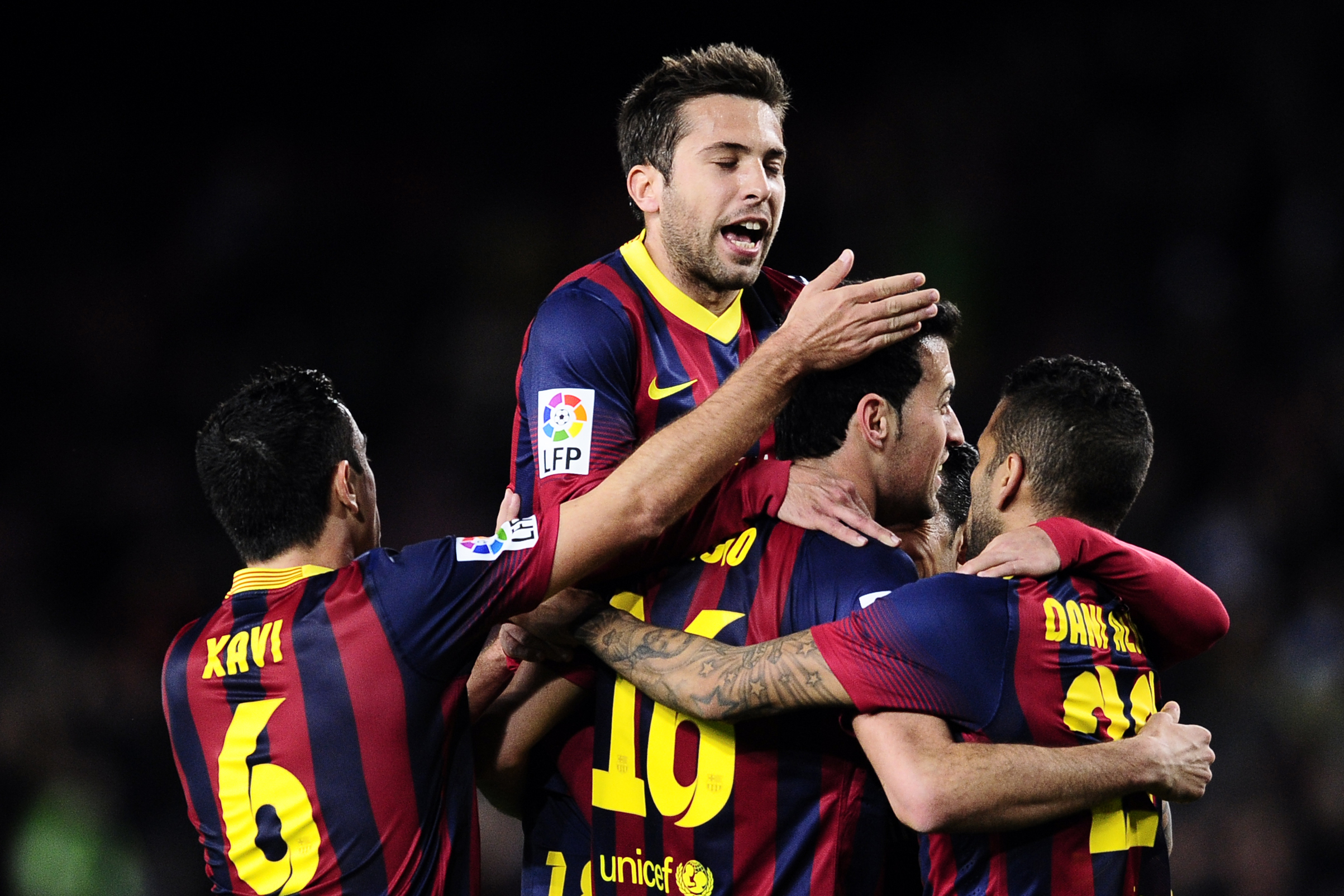 FC Barcelona's Sergio Busquets, second right, celebrates after scoring against with teammates against Real Sociedad during a Copa del Rey soccer match at the Camp Nou stadium in Barcelona, Spain, Wednesday, Feb. 5, 2014. (AP Photo/Manu Fernandez)