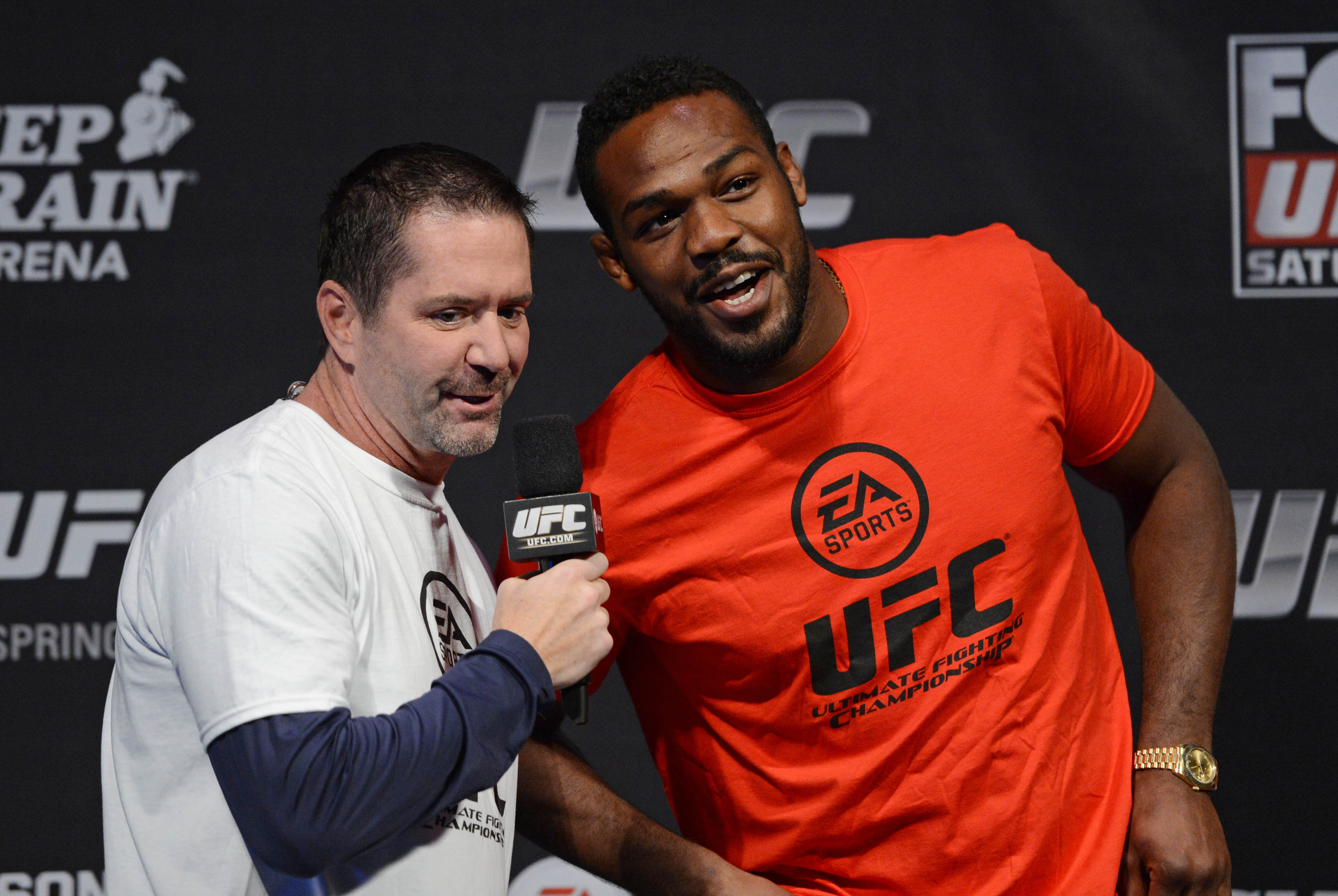 December 13, 2013; Sacramento, CA, USA; UFC light heavyweight Jon Jones (right) is interviewed on stage for the announcement of the EA Sports UFC video game cover winner before the official weigh-in for UFC on FOX 9 at Sleep Train Arena. Mandatory Credit: Kyle Terada-USA TODAY Sports