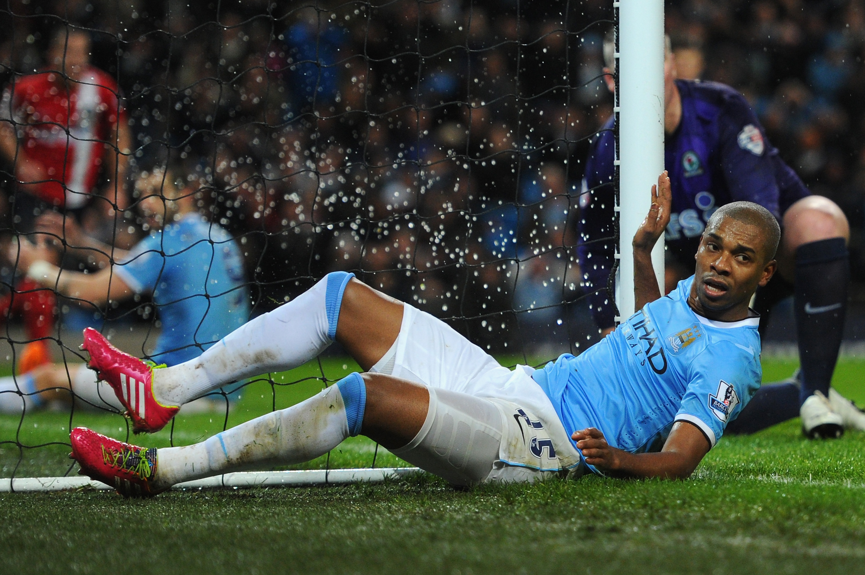 MANCHESTER, ENGLAND - JANUARY 15:  Fernandinho of Manchester City collides with the net during the Budweiser FA Cup Third Round Replay match between Manchester City and Blackburn Rovers at the Etihad Stadium on January 15, 2014 in Manchester, England.  (Photo by Stu Forster/Getty Images)