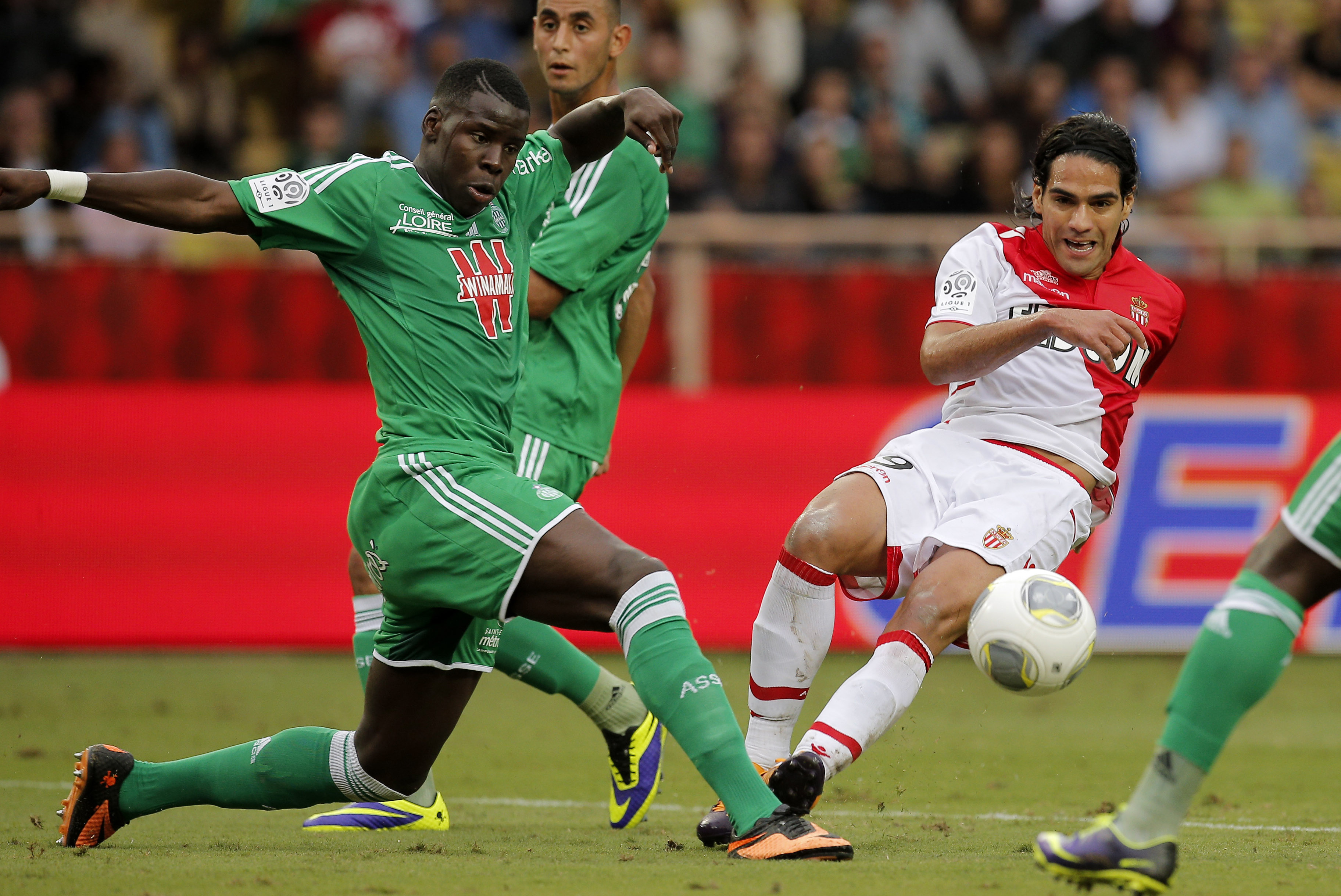 Monaco's Falcao, right, challenges for the ball with Saint Etienne's Kurt Zouma during their French League One soccer match at the Monaco stadium, Monaco, Saturday, Oct. 5, 2013. (AP Photo/Lionel Cironneau)