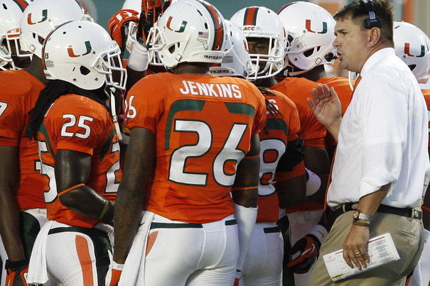 Miami head coach Al Golden, right, works on the sideline during the first half of an NCAA college football game against Savannah State, Saturday, Sept. 21, 2013, in Miami Gardens, Fla. (AP Photo/Lynne Sladky)