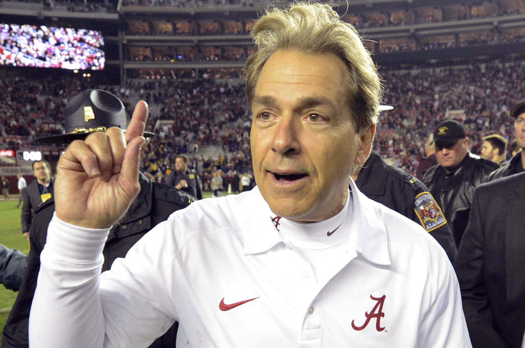 Nov 9, 2013; Tuscaloosa, AL, USA; Alabama Crimson Tide head coach Nick Saban celebrates as he leaves the field following their 38-17 victory over the LSU Tigers at Bryant-Denny Stadium. Mandatory Credit: John David Mercer-USA TODAY Sports