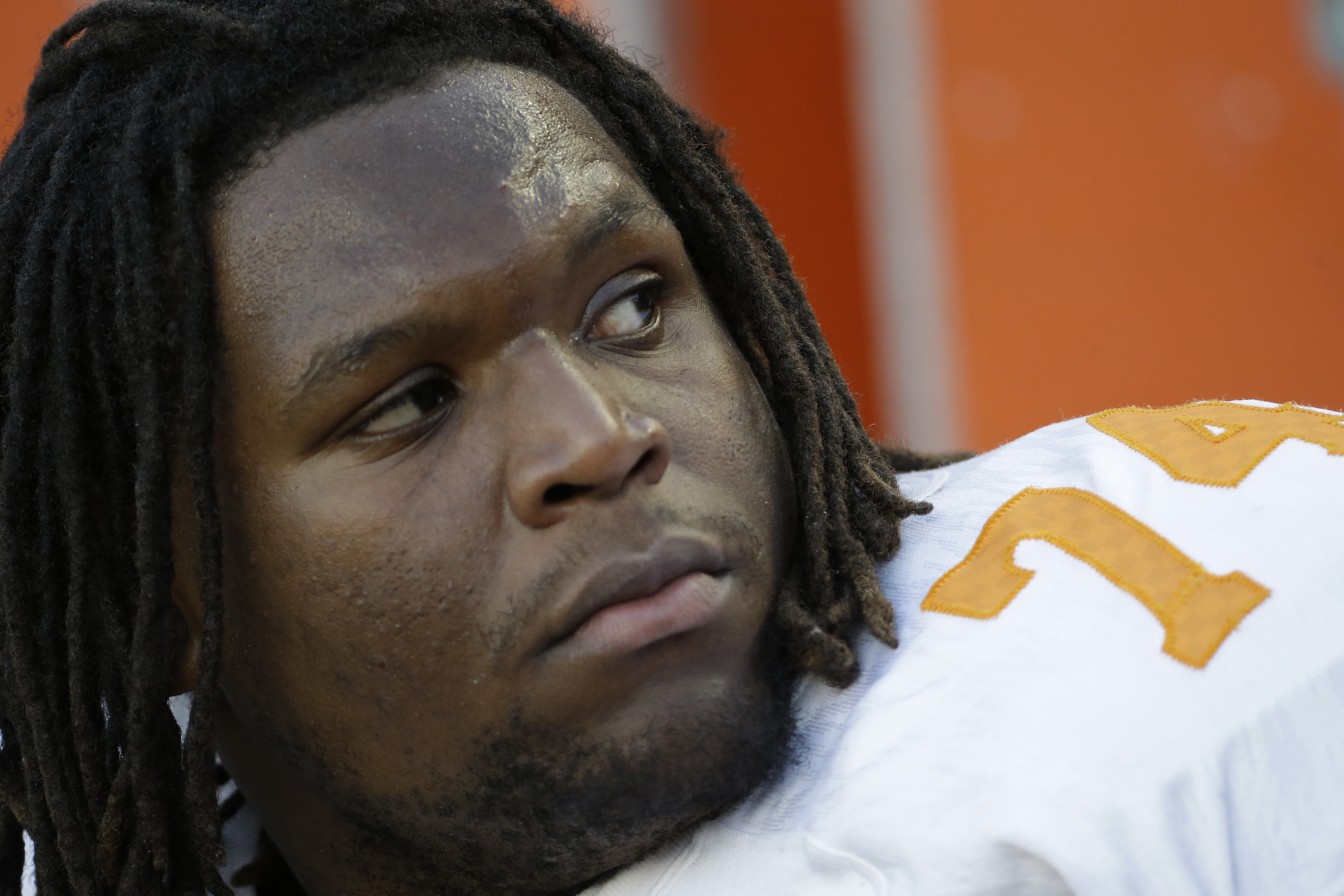 Tennessee offensive linesman Antonio Richardson (74) watches from the sidelines during the second half of an NCAA college football game against Alabama in Tuscaloosa, Ala., Saturday, Oct. 26, 2013. (AP Photo/Dave Martin)