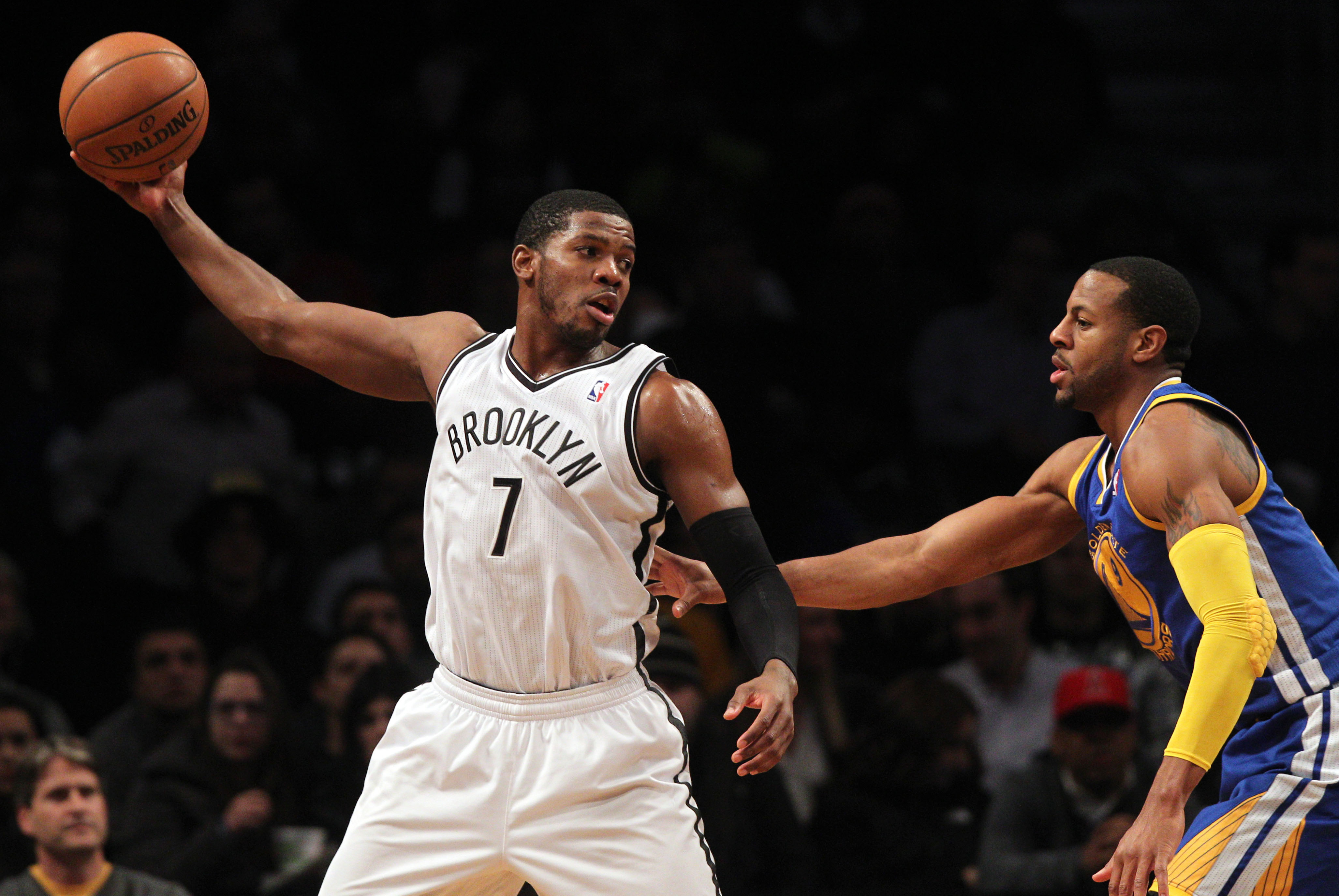 Jan 8, 2014; Brooklyn, NY, USA; Brooklyn Nets shooting guard Joe Johnson (7) controls the ball against Golden State Warriors small forward Andre Iguodala (9) during the first quarter of a game at Barclays Center. The Nets defeated the Warriors 102-98. Mandatory Credit: Brad Penner-USA TODAY Sports
