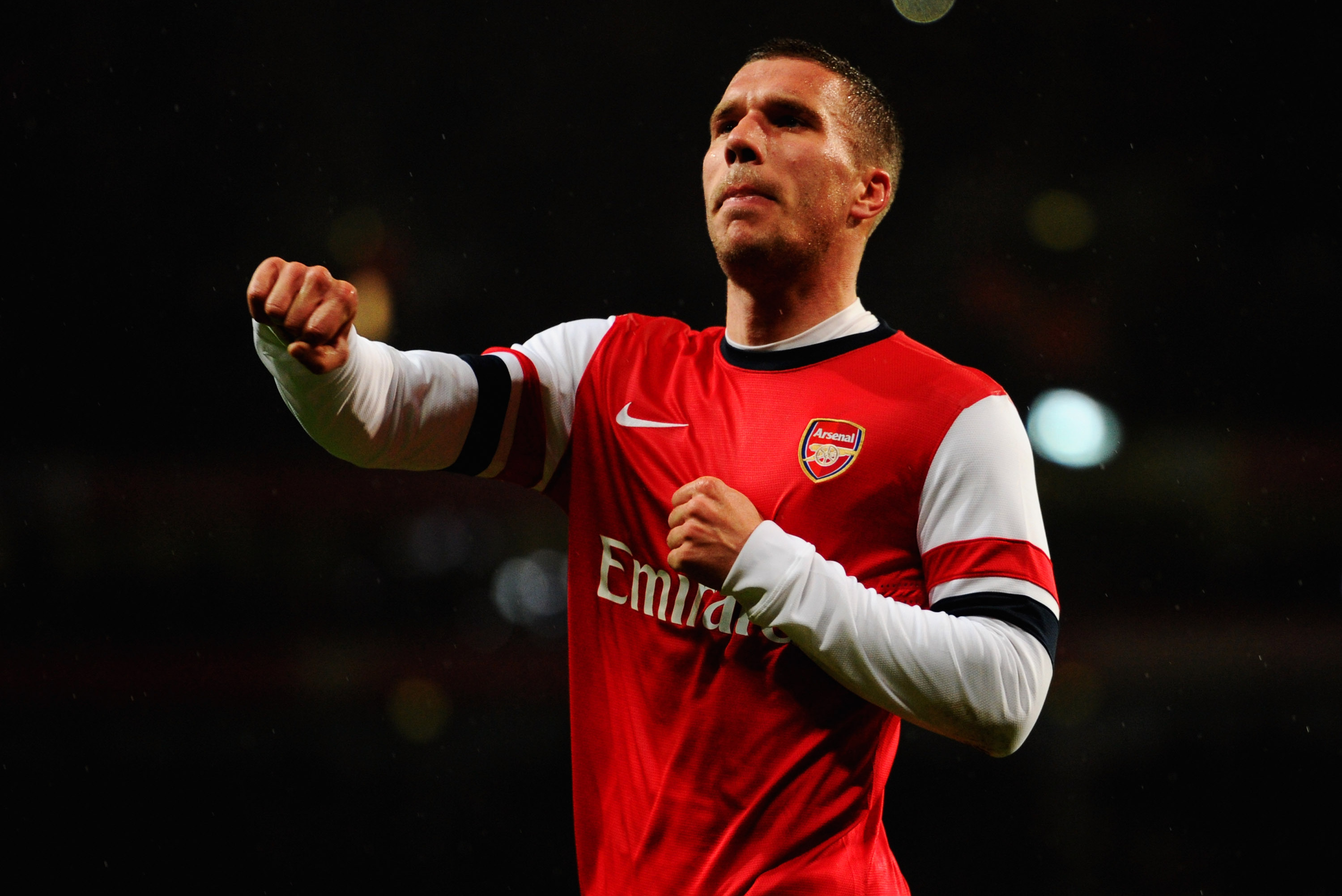 LONDON, ENGLAND - JANUARY 24:  Lukas Podolski of Arsenal celebrates as he scores their second goal with a header during the FA Cup with Budweiser Fourth round match between Arsenal and Coventry City at Emirates Stadium on January 24, 2014 in London, England.  (Photo by Mike Hewitt/Getty Images)