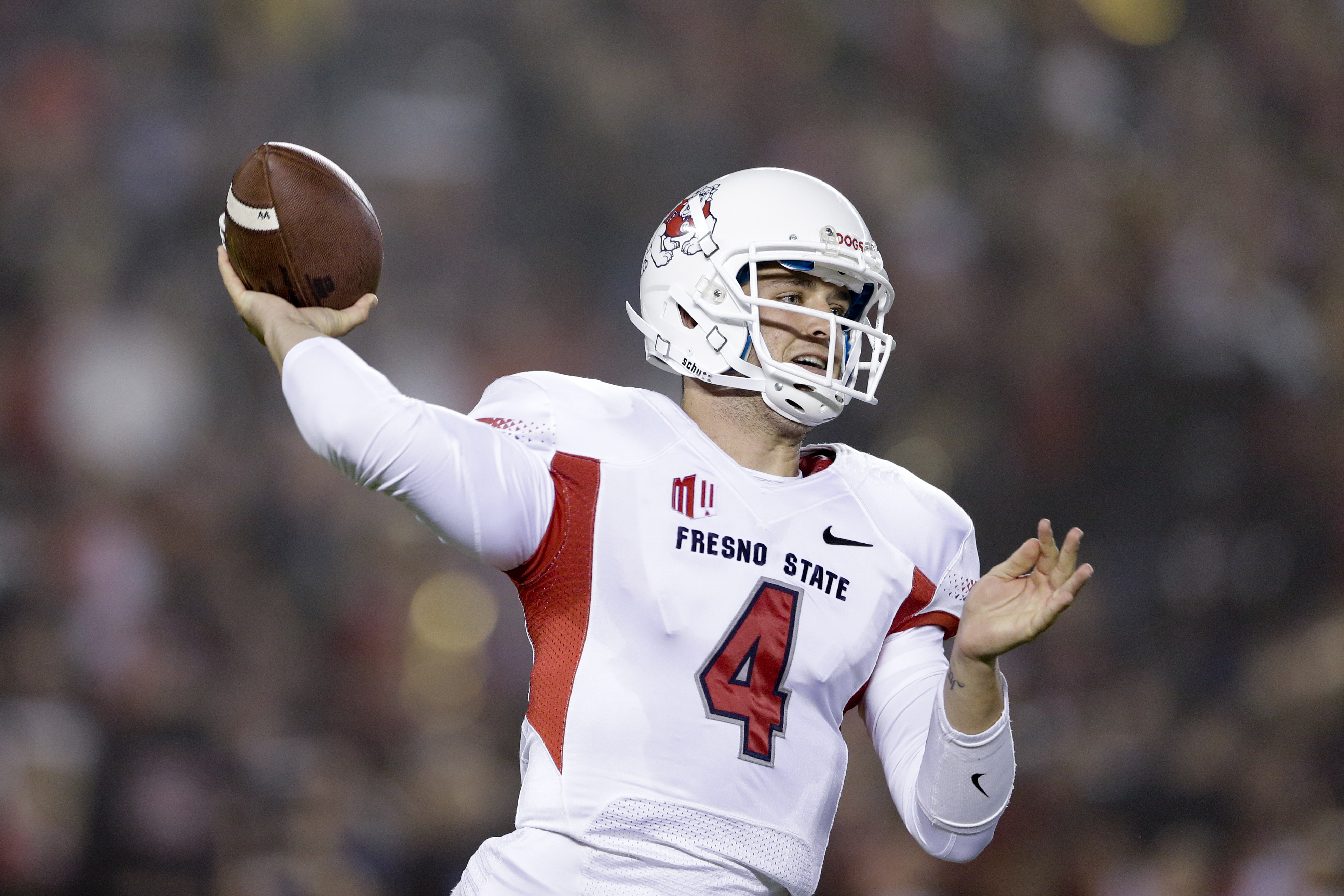 Fresno State quarterback Derek Carr throws a pass while playing San Diego State during the second half in an NCAA college football game Saturday, Oct. 26, 2013, in San Diego. (AP Photo/Gregory Bull)