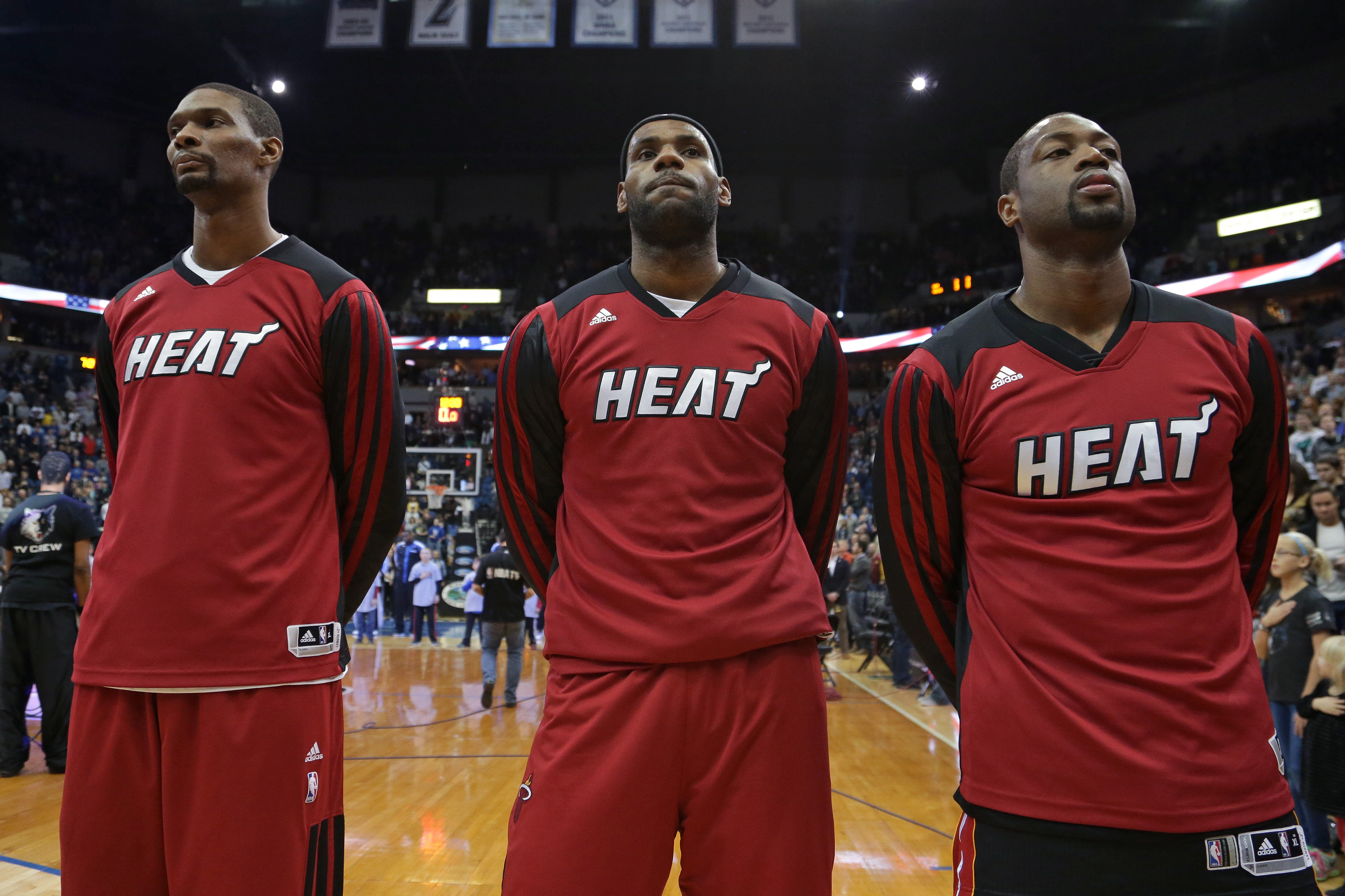 MINNEAPOLIS, MN - DECEMBER 7:  Chris Bosh #1, LeBron James #6 and Dwyane Wade #3 of the Miami Heat stand on the court against the Minnesota Timberwolves on December 7, 2013 at Target Center in Minneapolis, Minnesota. NOTE TO USER: User expressly acknowledges and agrees that, by downloading and or using this Photograph, user is consenting to the terms and conditions of the Getty Images License Agreement. Mandatory Copyright Notice: Copyright 2013 NBAE (Photo by Jordan Johnson/NBAE via Getty Images)