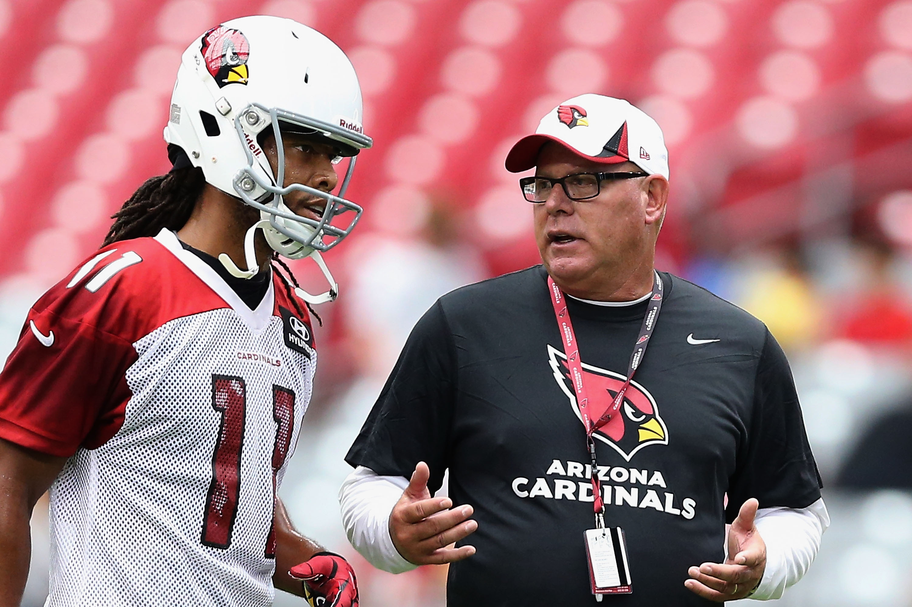 GLENDALE, AZ - JULY 26:  Head coach Bruce Arians of the Arizona Cardinals talks with wide receiver Larry Fitzgerald #11 during the team training camp at University of Phoenix Stadium on July 26, 2013 in Glendale, Arizona.  (Photo by Christian Petersen/Getty Images)