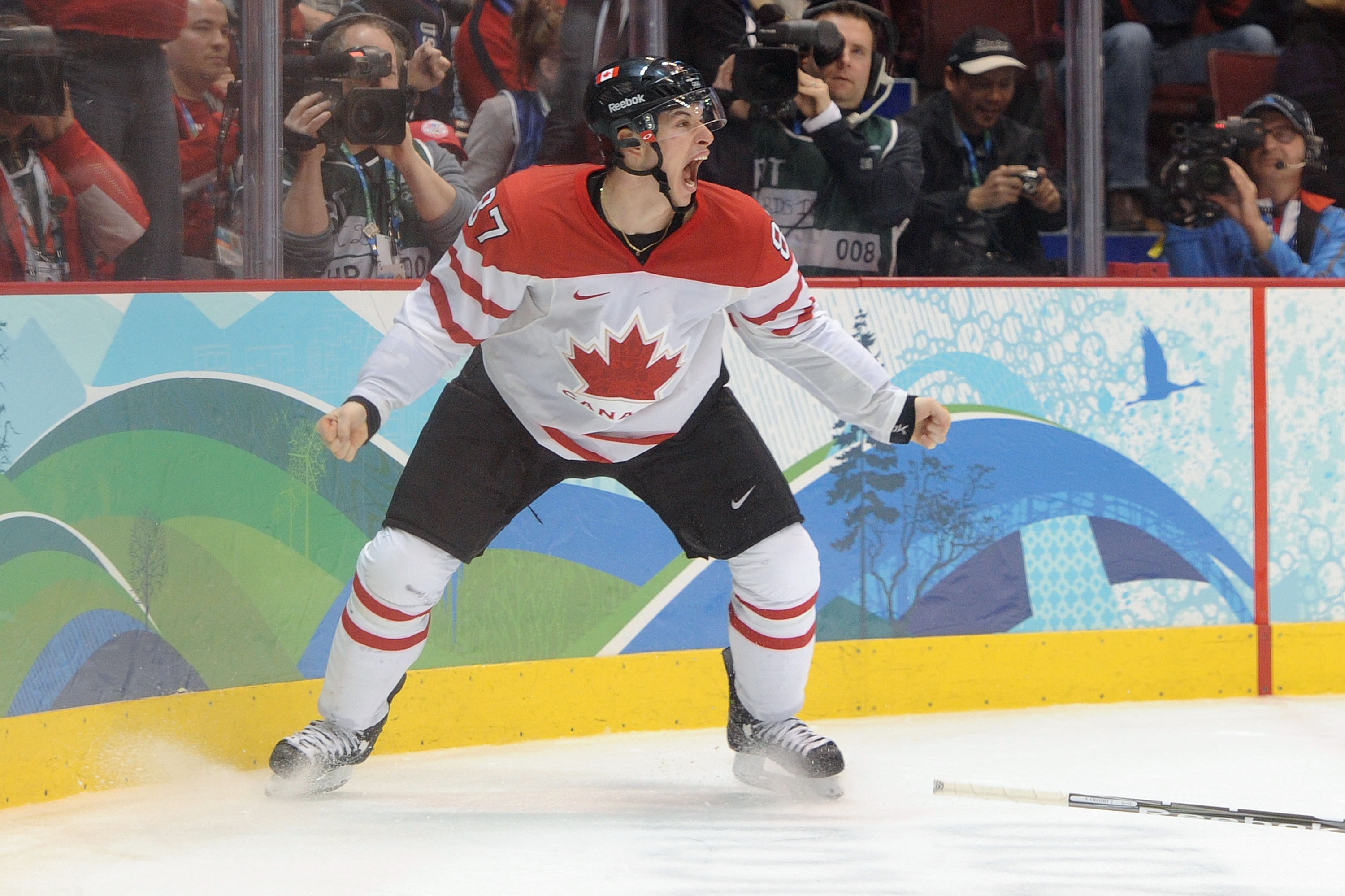 VANCOUVER, BC - FEBRUARY 28:  Sidney Crosby #87 of Canada celebrates after scoring  the matchwinning goal in overtime during the ice hockey men's gold medal game between USA and Canada on day 17 of the Vancouver 2010 Winter Olympics at Canada Hockey Place on February 28, 2010 in Vancouver, Canada.  (Photo by Harry How/Getty Images)
