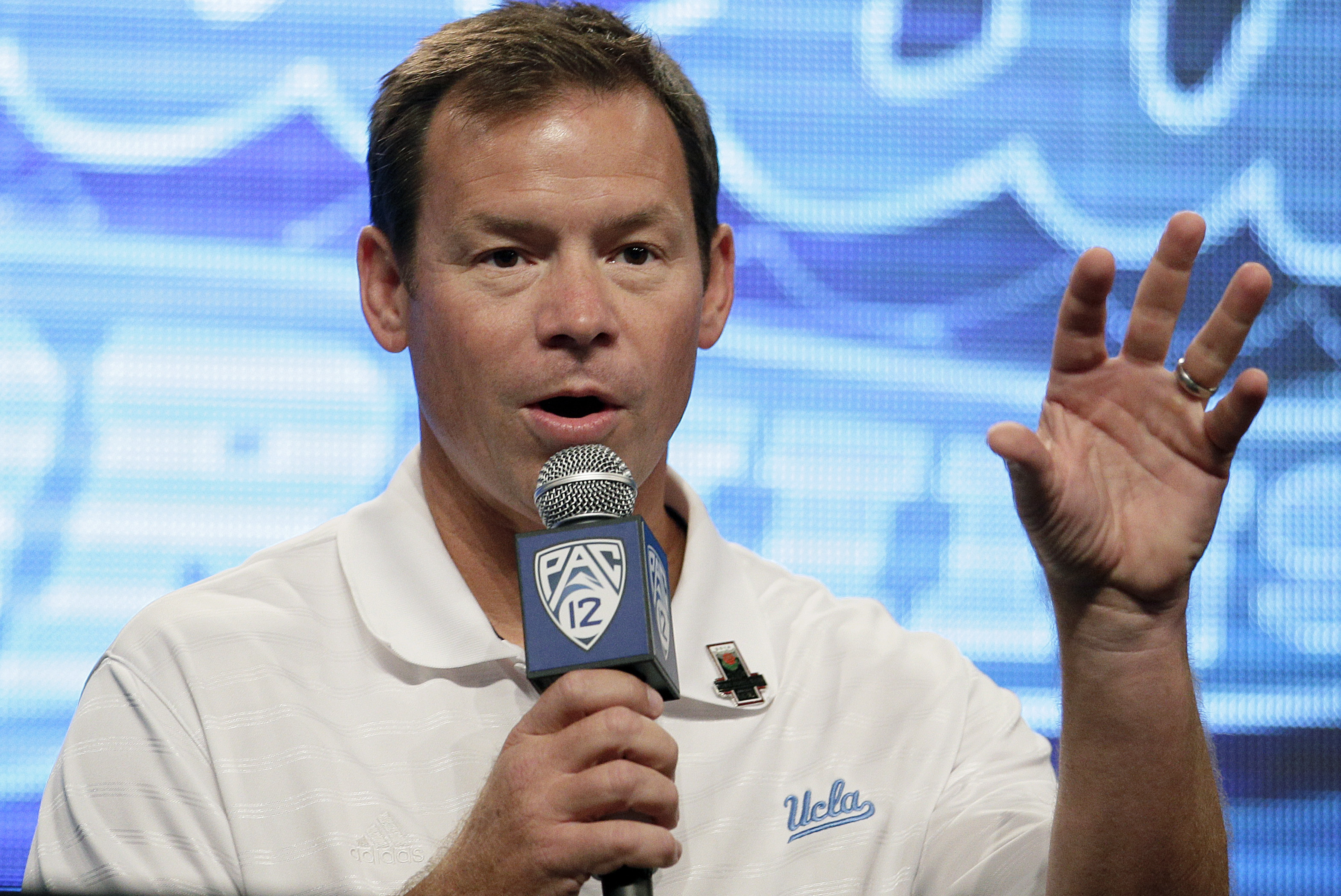 UCLA head coach Jim Mora talks to the media during the NCAA college football Pac-12 media day on Friday, July 26, 2013, in Culver City, Calif. (AP Photo/Jae C. Hong)