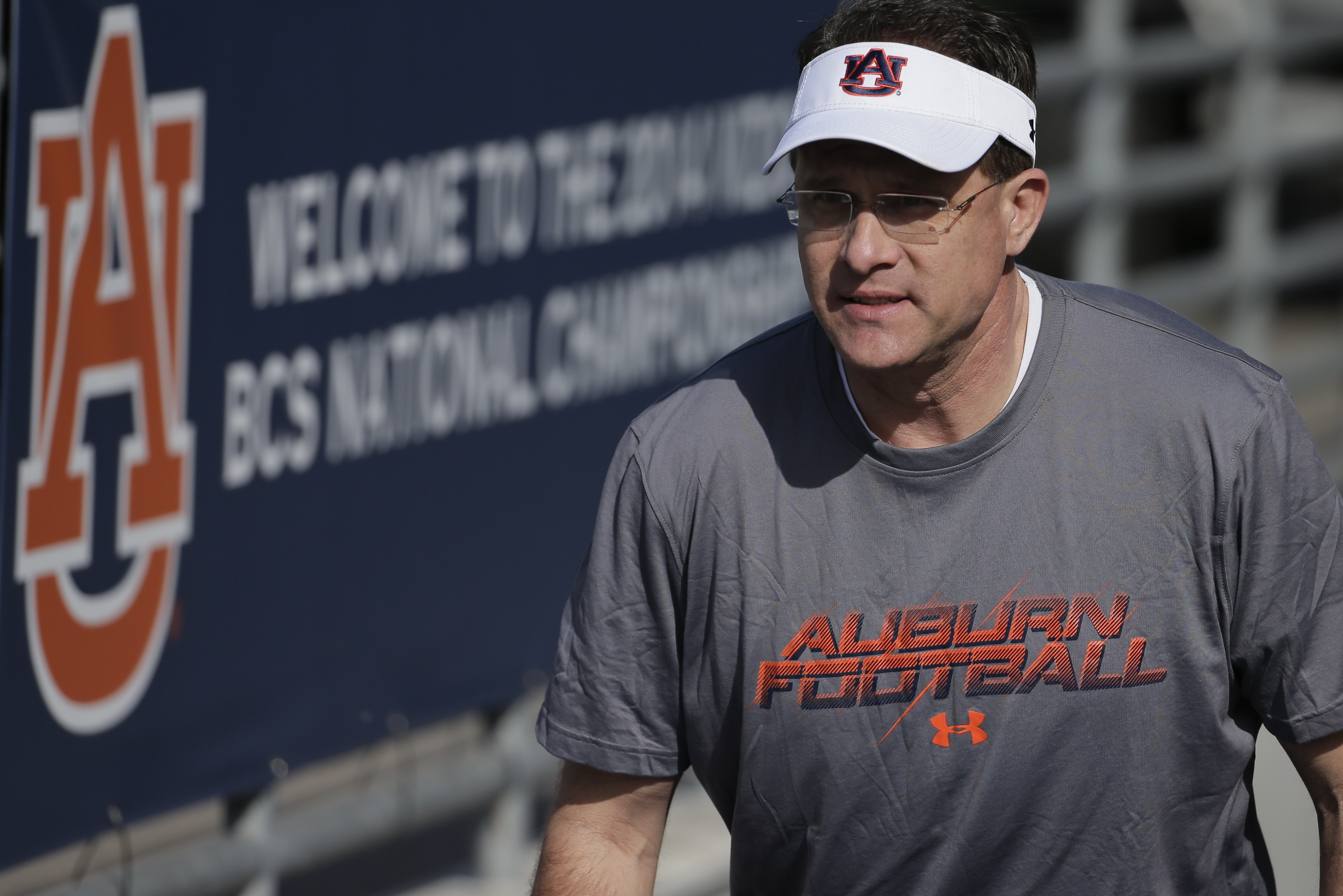 Auburn coach Gus Malzahn arrives for NCAA college football practice on Friday, Jan. 3, 2014, in Irvine, Calif. Auburn is scheduled to play Florida State on Monday in the BCS national championship game. (AP Photo/Chris Carlson)