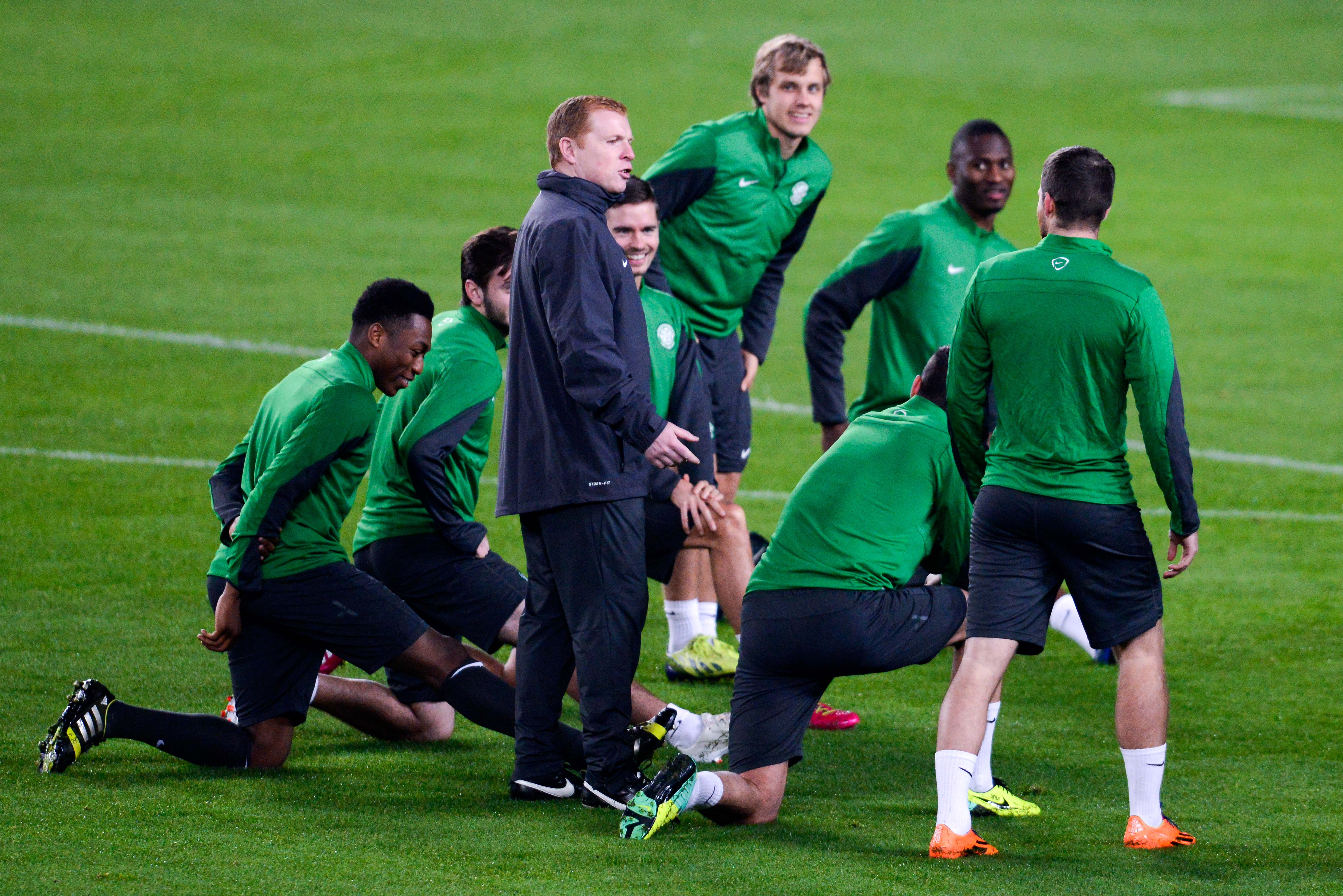 BARCELONA, SPAIN - DECEMBER 10:  Celtic manager Neil Lennon speaks with his players during a training session ahead their UEFA Champions League Group H match between FC Barcelona and Celtic FC at the Camp Nou Stadium on December 10, 2013 in Barcelona, Spain.  (Photo by David Ramos/Getty Images)