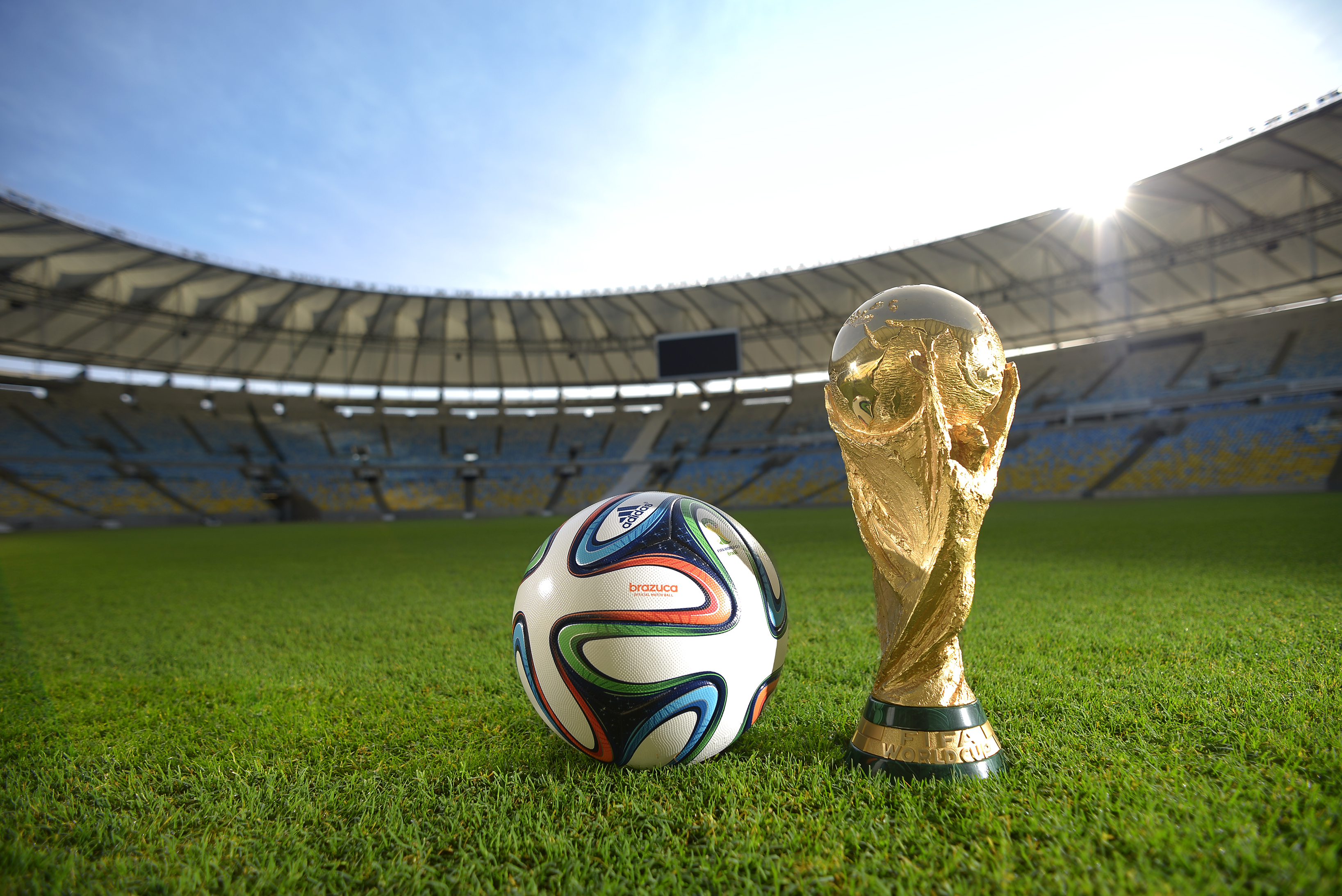 RIO DE JANEIRO, BRAZIL - DECEMBER 03:  A general view of Brazuca and the FIFA World Cup Trophy at the Maracana before the adidas Brazuca launch at Parque Lage on December 3, 2013 in Rio de Janeiro, Brazil. Brazuca is the Official Match Ball for the FIFA World Cup 2014 Brazil. Tonight adidas revealed brazuca to the world in the stunning setting of Parque Lage in Rio de Janeiro. The reveal was part of a spectacular light projection supported by global footballers Seedorf, Hernane and FIFA World Cup Winner Cafu. Hundreds of guests and celebrities were treated to this one off experience, which launched the Official FIFA World Cup Ball for Brazil 2014. For more information visit: news.adidas.com/worldcupOMB  (Photo by Alexandre Loureiro/Getty Images for adidas)