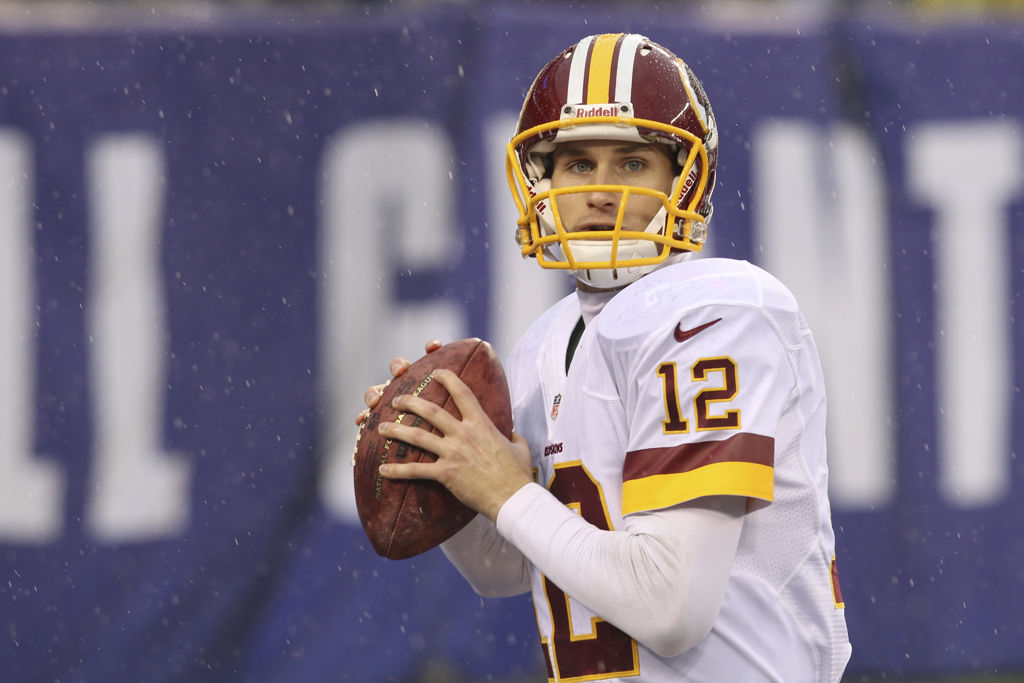 Washington Redskins quarterback Kirk Cousins (12) warms up before an NFL football game against the New York Giants Sunday, Dec. 29, 2013, in East Rutherford, N.J.  (AP Photo/Peter Morgan)