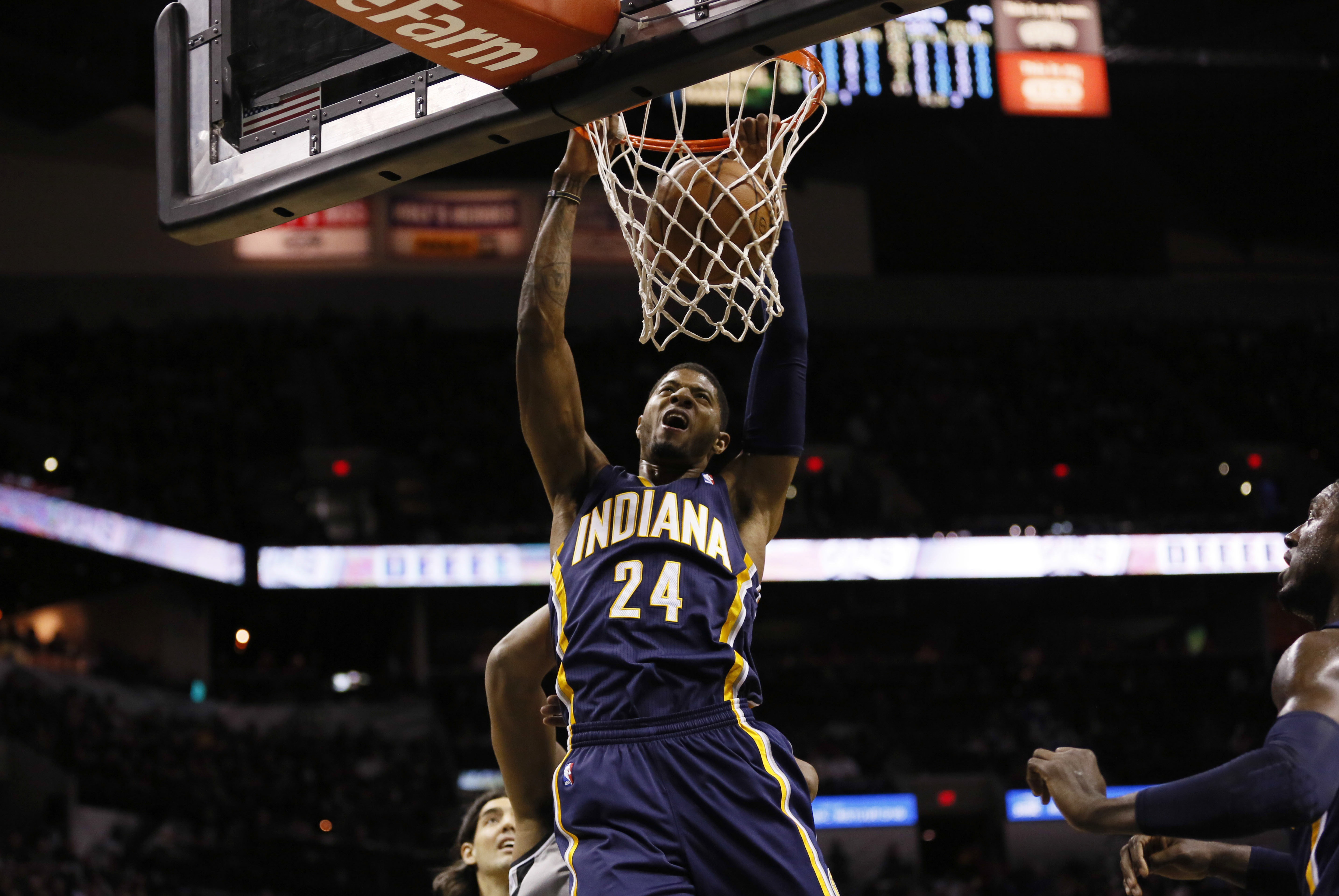 Dec 7, 2013; San Antonio, TX, USA; Indiana Pacers forward Paul George (24) dunks during the first half against the San Antonio Spurs at AT&T Center. Mandatory Credit: Soobum Im-USA TODAY Sports