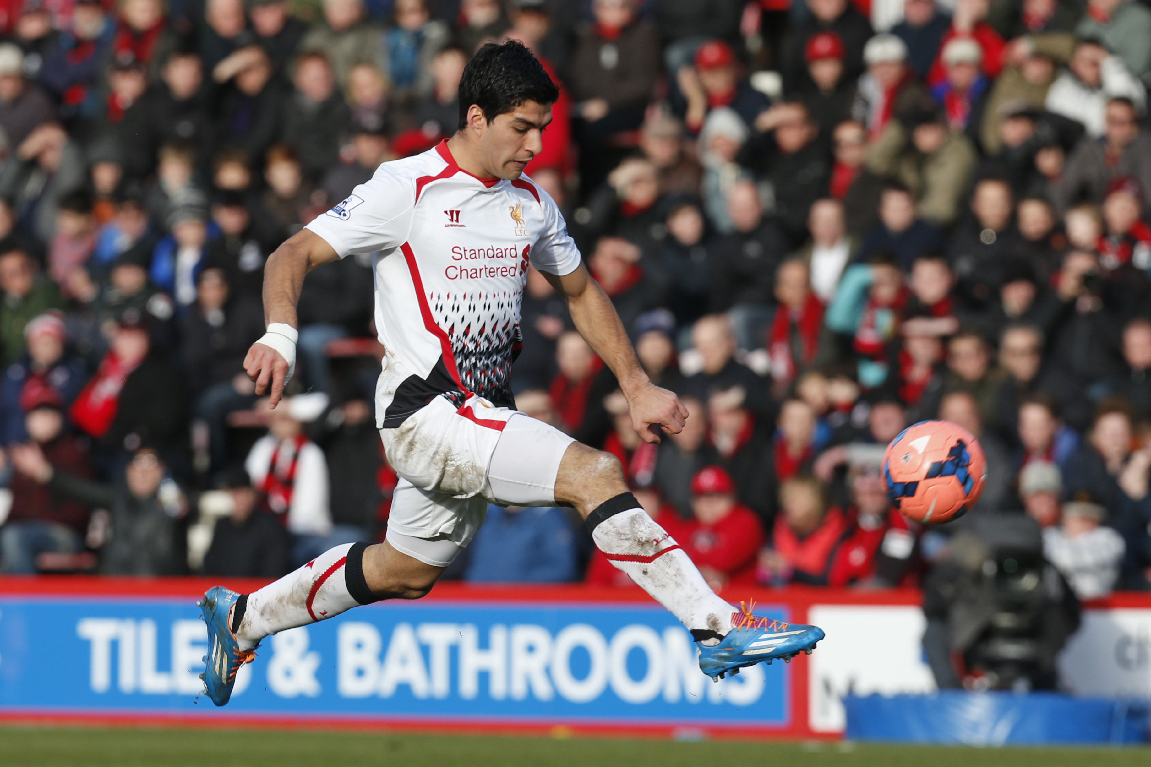 Liverpool's Luis Suarez controls the ball during an English FA Cup 4th round soccer match against AFC Bournemouth in Bournemouth, south England, Saturday, Jan. 25, 2014. Liverpool won the match 2-0.(AP Photo/Lefteris Pitarakis)