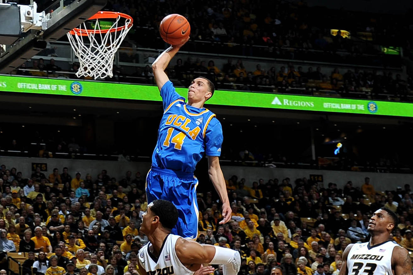 Dec 7, 2013; Columbia, MO, USA; UCLA Bruins guard Zach LaVine (14) dunks the ball over Missouri Tigers guard Jordan Clarkson (5) during the first half at Mizzou Arena. Mandatory Credit: Dak Dillon-USA TODAY Sports