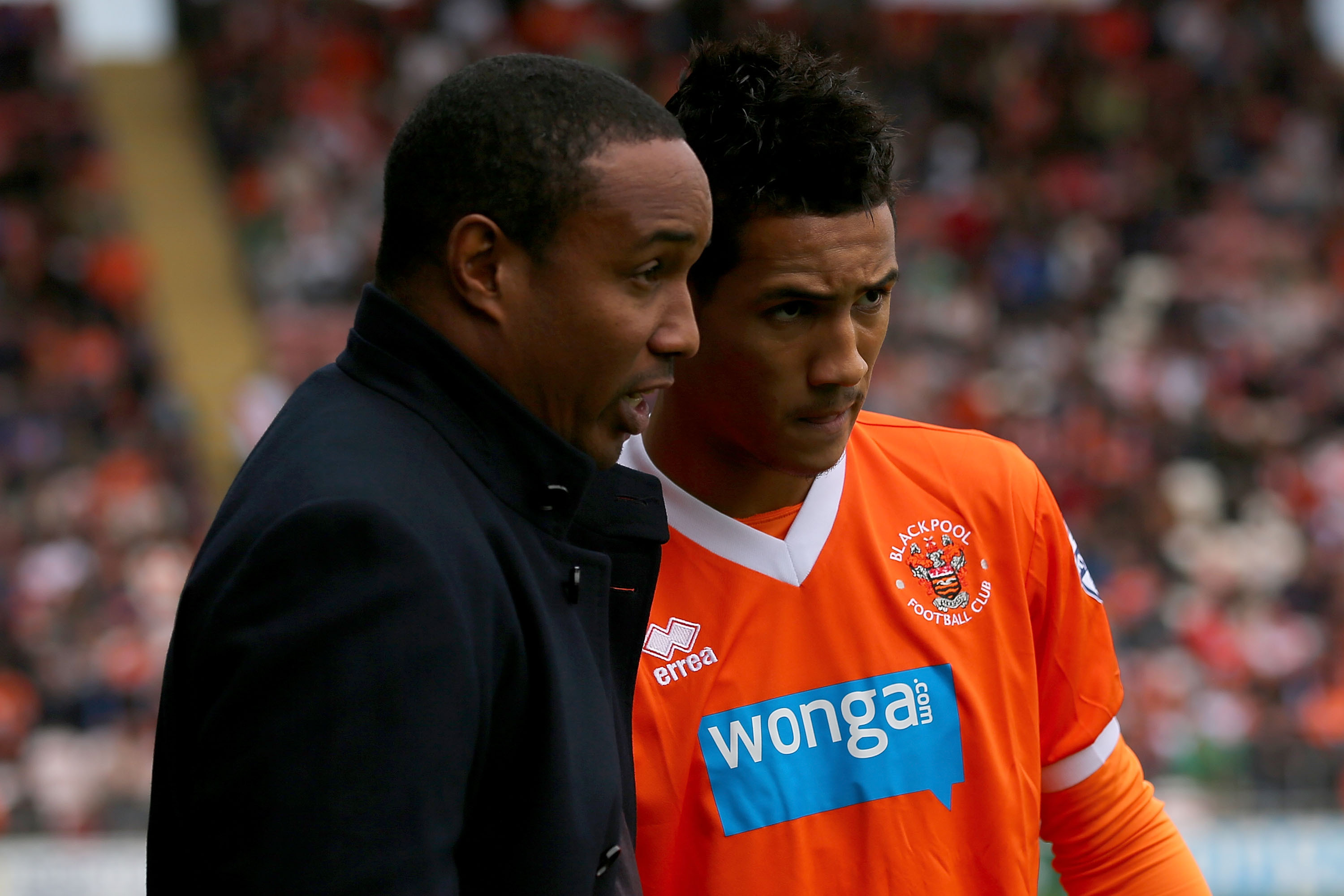 BLACKPOOL, ENGLAND - SEPTEMBER 21:  Paul Ince of Blackpool speaks with son Tom Ince prior to kick off in the Sky Bet Championship match between Blackpool and Leicester City at Bloomfield Road on September 21, 2013 in Blackpool, England,  (Photo by Clive Rose/Getty Images)