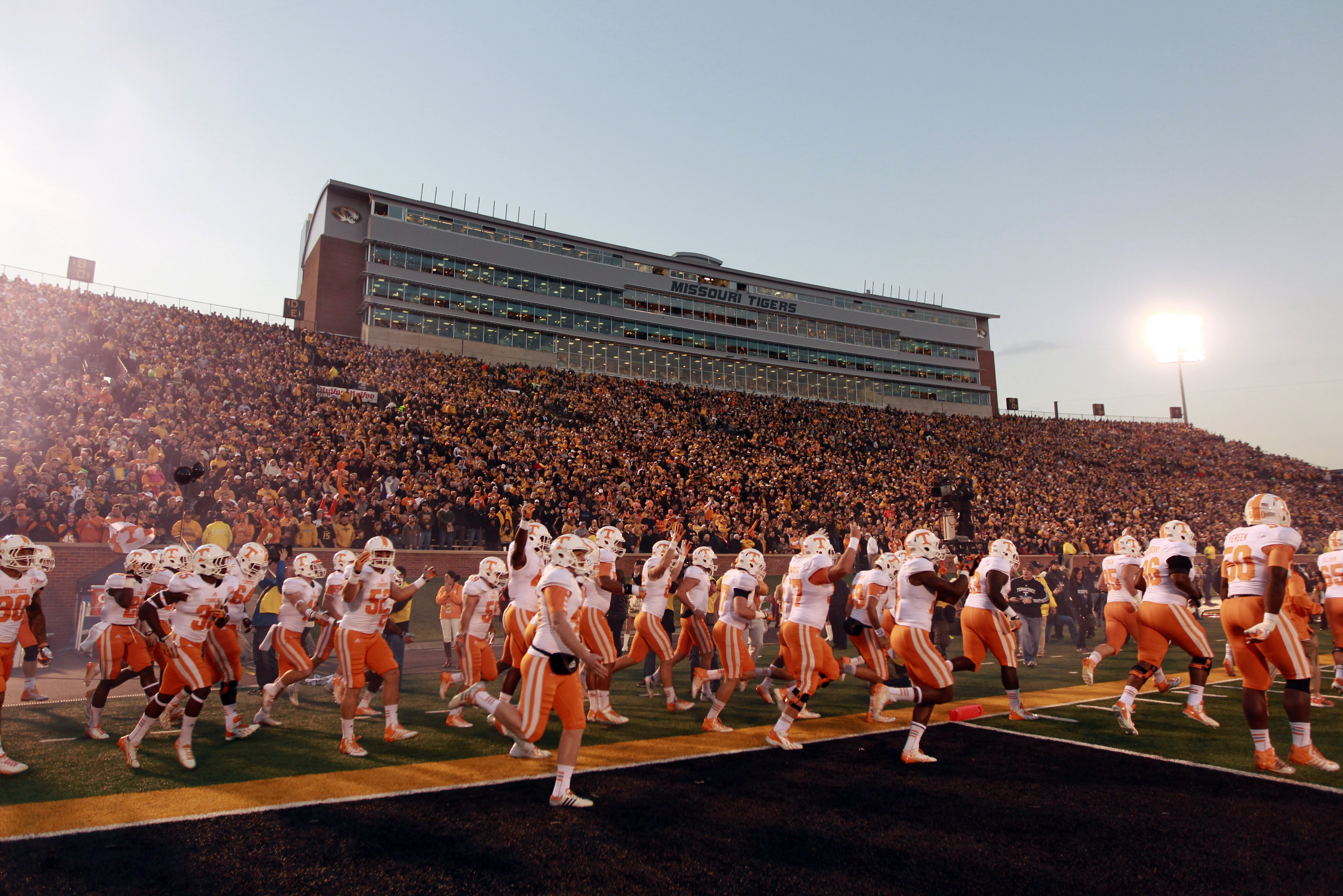 Members of the Tennessee Volunteers run onto the field at the start of an NCAA college football game against Missouri Saturday, Nov. 2, 2013, in Columbia, Mo. (AP Photo/Jeff Roberson)