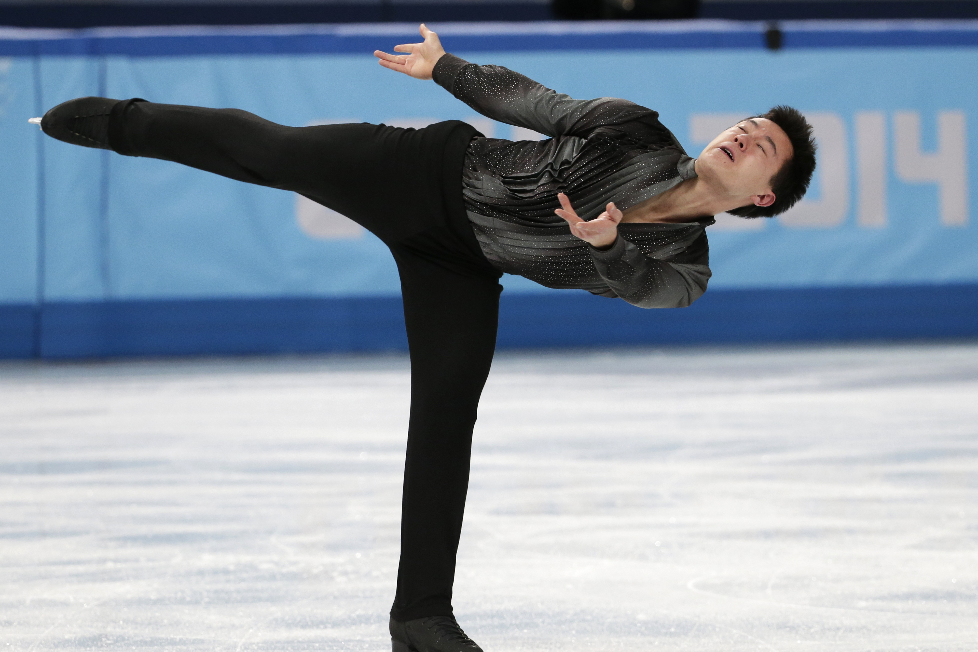 Patrick Chan of Canada competes in the men's team short program figure skating competition at the Iceberg Skating Palace during the 2014 Winter Olympics, Thursday, Feb. 6, 2014, in Sochi, Russia. (AP Photo/Bernat Armangue)