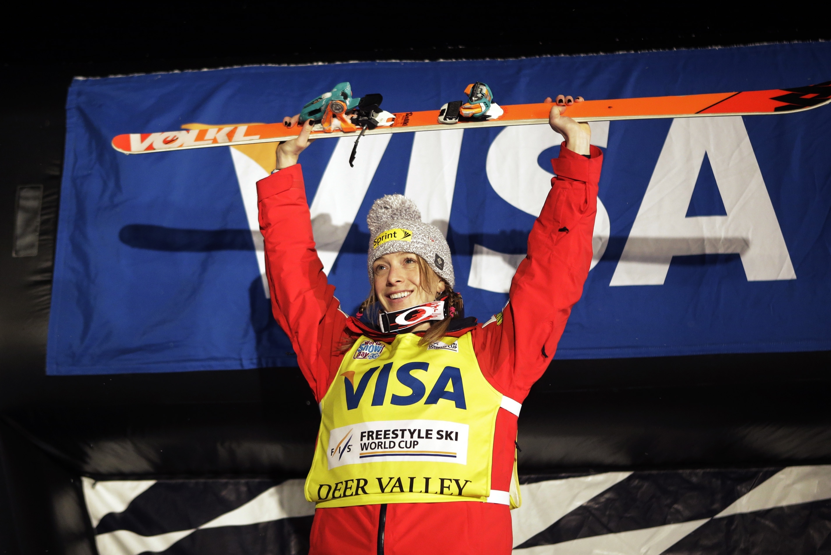 Hannah Kearney, of the United States, celebrates on the podium after winning the women's freestyle World Cup moguls event Saturday, Jan. 11, 2014, in Park City, Utah. (AP Photo/Rick Bowmer)
