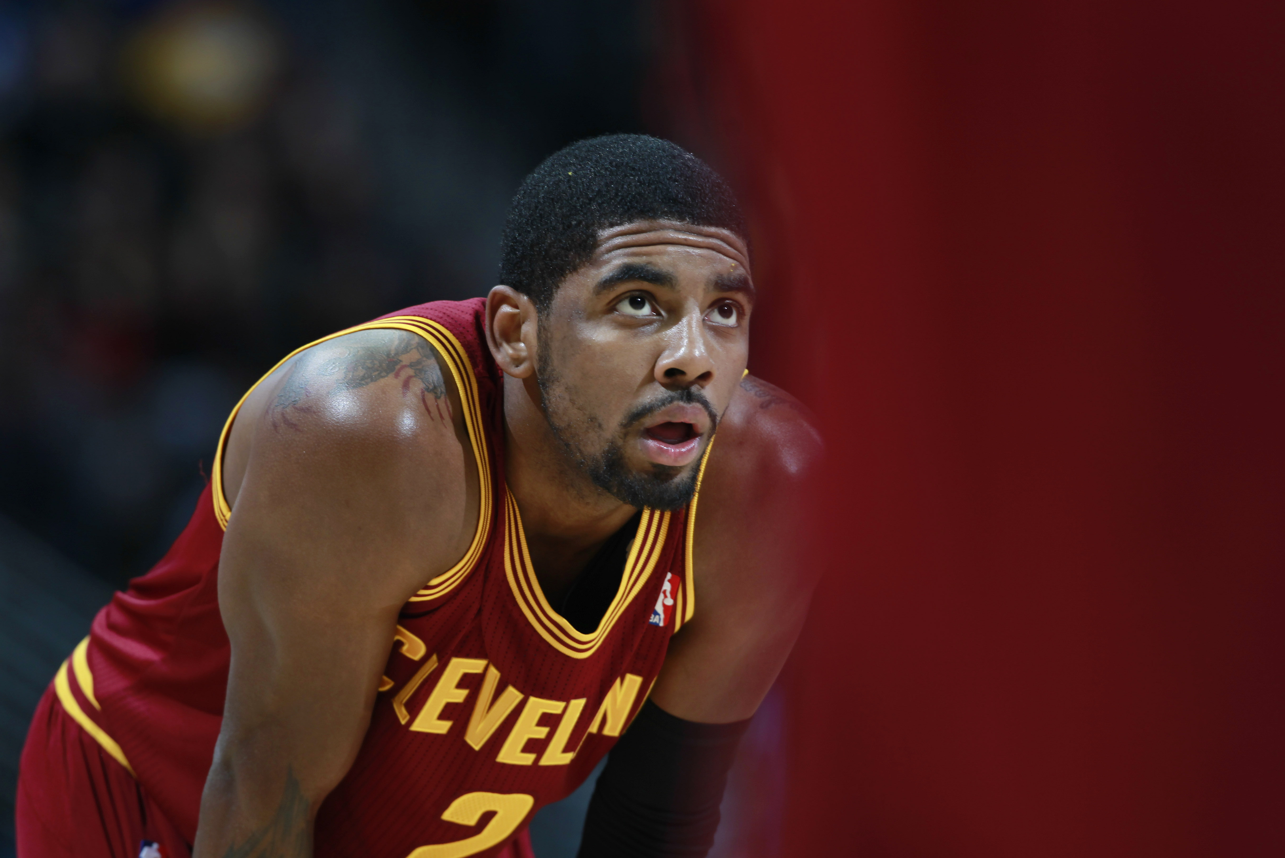 Cleveland Cavaliers guard Kyrie Irving looks on against the Denver Nuggets in the third quarter of the Cavaliers' 117-109 victory in an NBA basketball game in Denver on Friday, Jan. 17, 2014. (AP Photo/David Zalubowski)