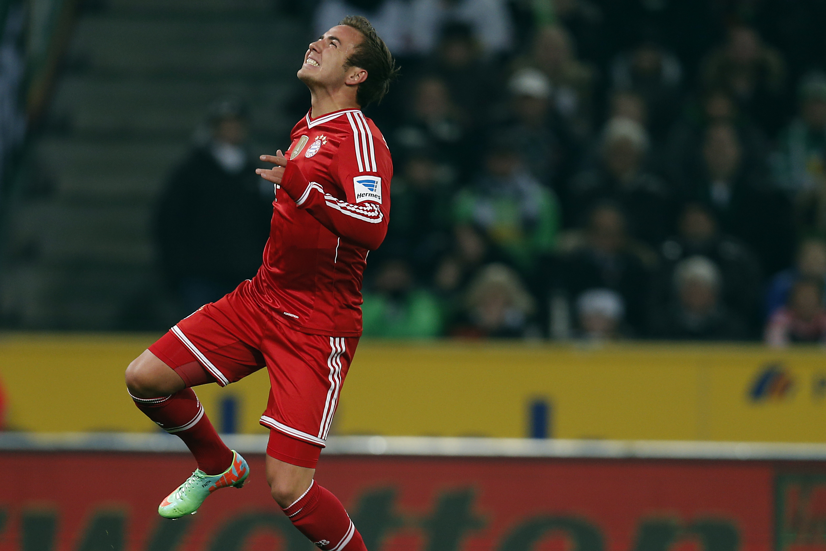 Bayern's Mario Goetze jumps  during the German first division Bundesliga soccer match between VfL Borussia Moenchengladbach and Bayern Munich in Moenchengladbach, Germany, Friday, Jan. 24, 2014. (AP Photo/Frank Augstein)
