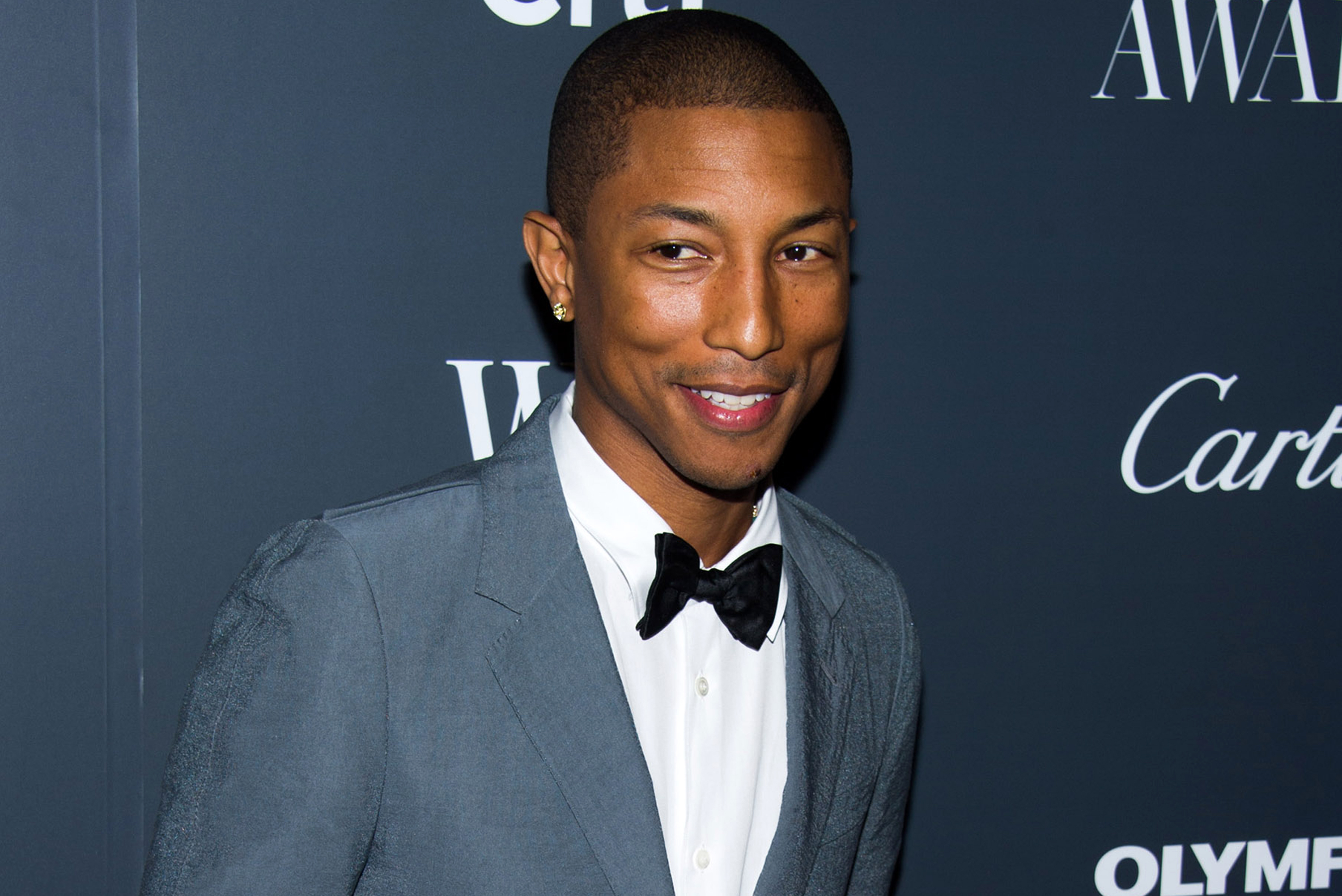 FILE - In this Nov. 6, 2013 file photo, Pharrell Williams attends the WSJ. Magazine's Innovator Awards in New York. Williams' “Happy,” from the “Despicable Me 2” soundtrack, was nominated for an Academy Award for  best original song  on Thursday, Jan. 16, 2014 . The 86th Academy Awards will be held on March 2.  (Photo by Charles Sykes/Invision/AP, File)