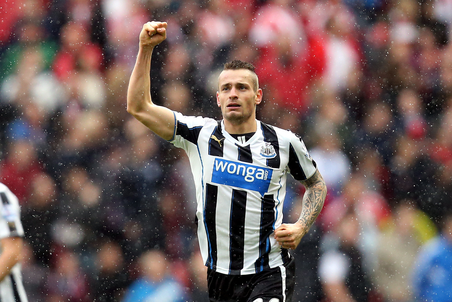 Newcastle United's Mathieu Debuchy celebrates his goal during their English Premier League soccer match against Sunderland at the Stadium of Light, Sunderland, England, Sunday, Oct. 27, 2013. (AP Photo/Scott Heppell)