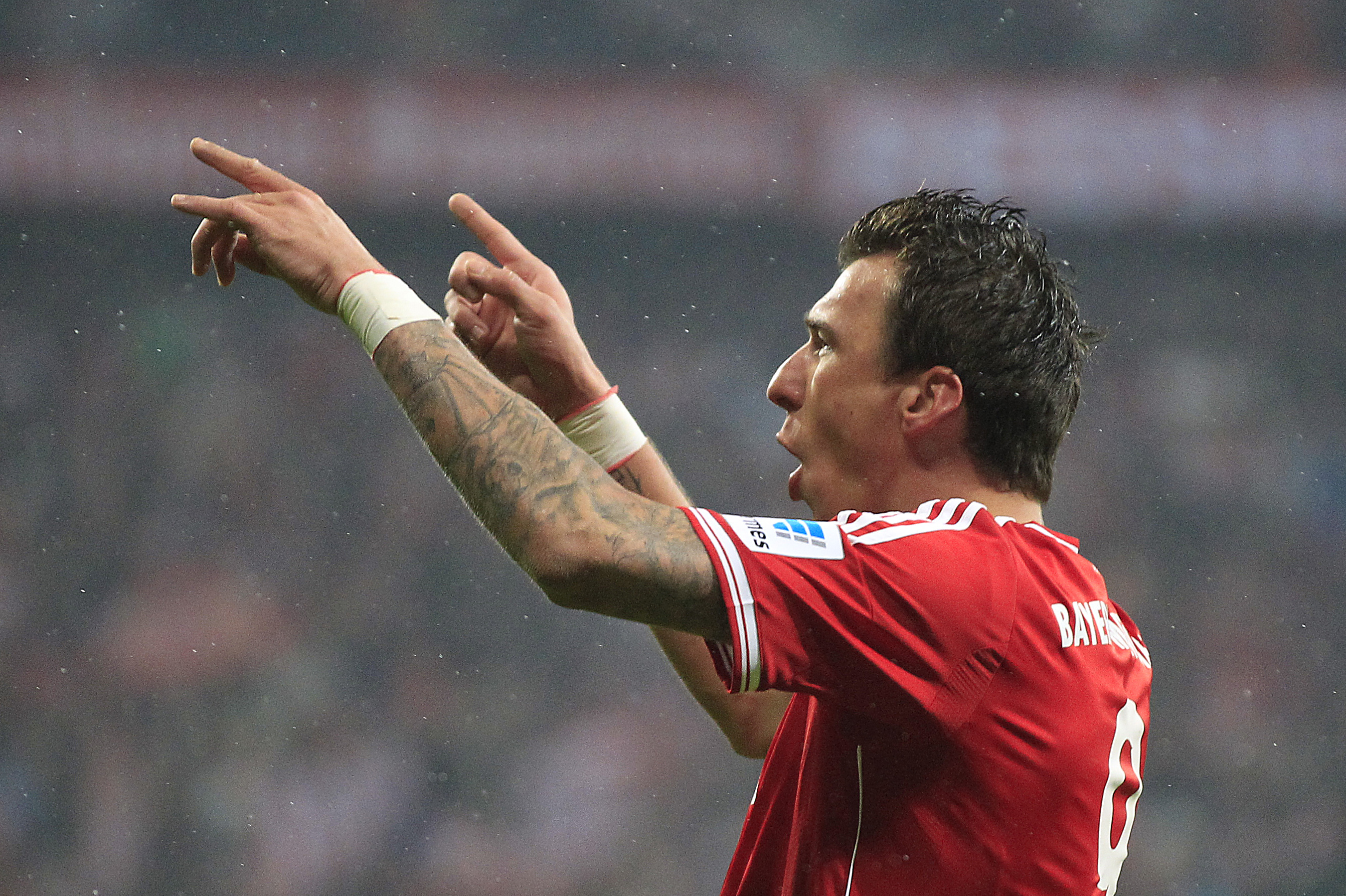 Bayern's Mario Mandzukic of Croatia celebrates after scoring during the German first division Bundesliga soccer match between Bayern Munich and Eintracht Frankfurt in Munich, Germany, Sunday, Feb. 2, 2014. (AP Photo/Frank Augstein)