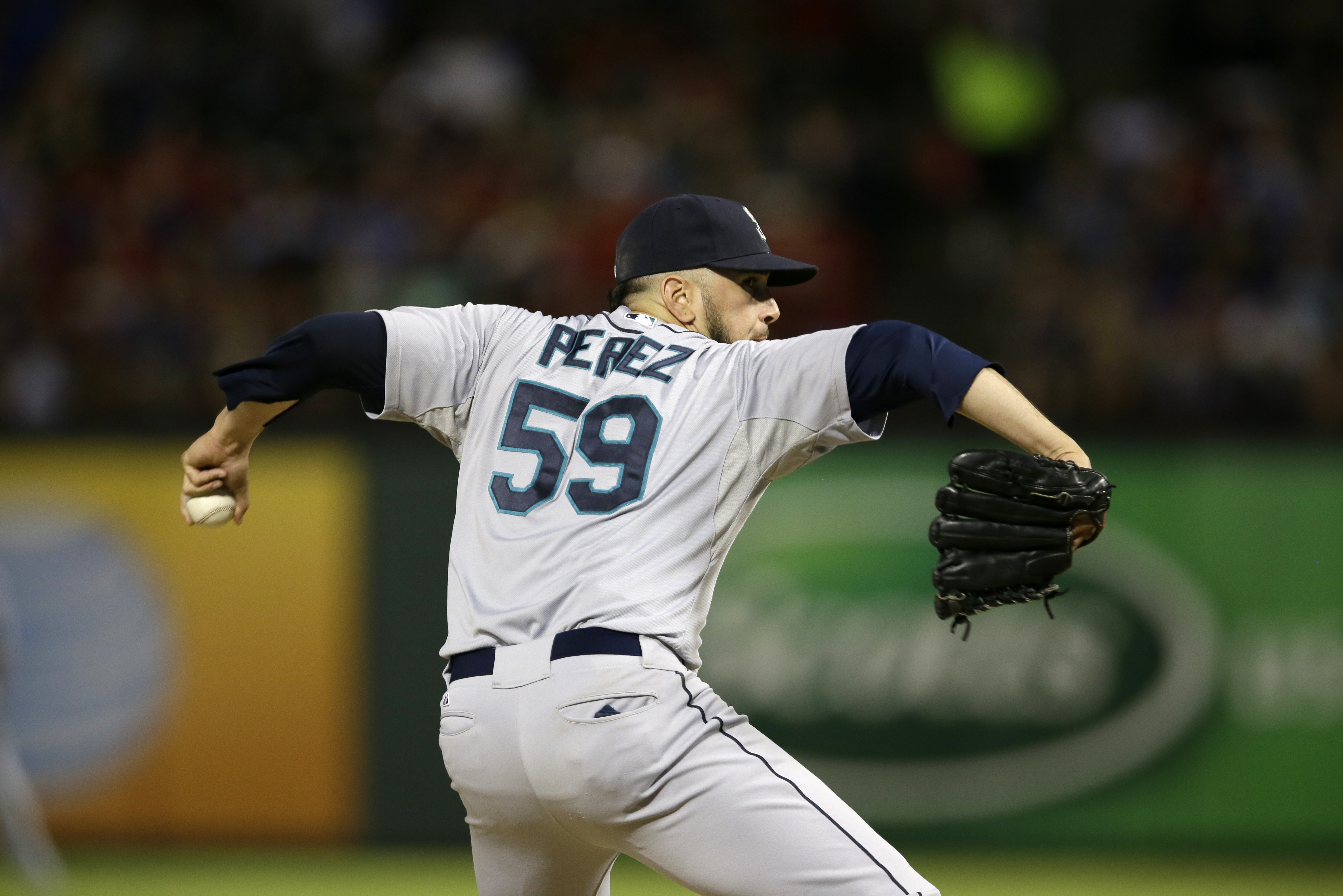 Seattle Mariners relief pitcher Oliver Perez (59) works against the Texas Rangers in the seventh inning of a baseball game, Saturday, Aug. 17, 2013, in Arlington, Texas. (AP Photo/Tony Gutierrez)