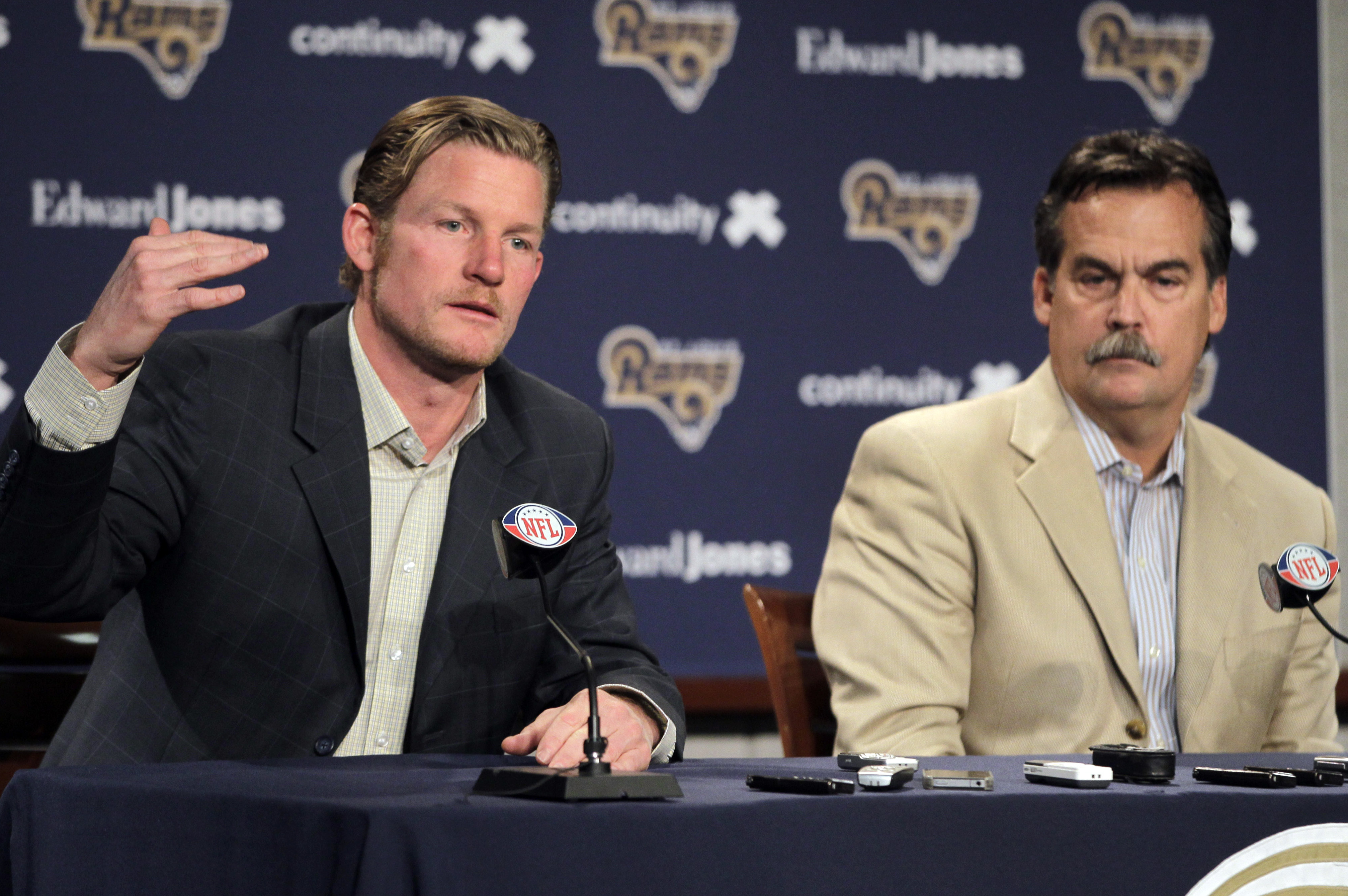 St. Louis Rams general manager Les Snead, left, and head coach Jeff Fisher discuss the Rams' prospects in the upcoming NFL football draft on Wednesday, April 25, 2012, at the teams' training facility in St. Louis. (AP Photo/Jeff Roberson)