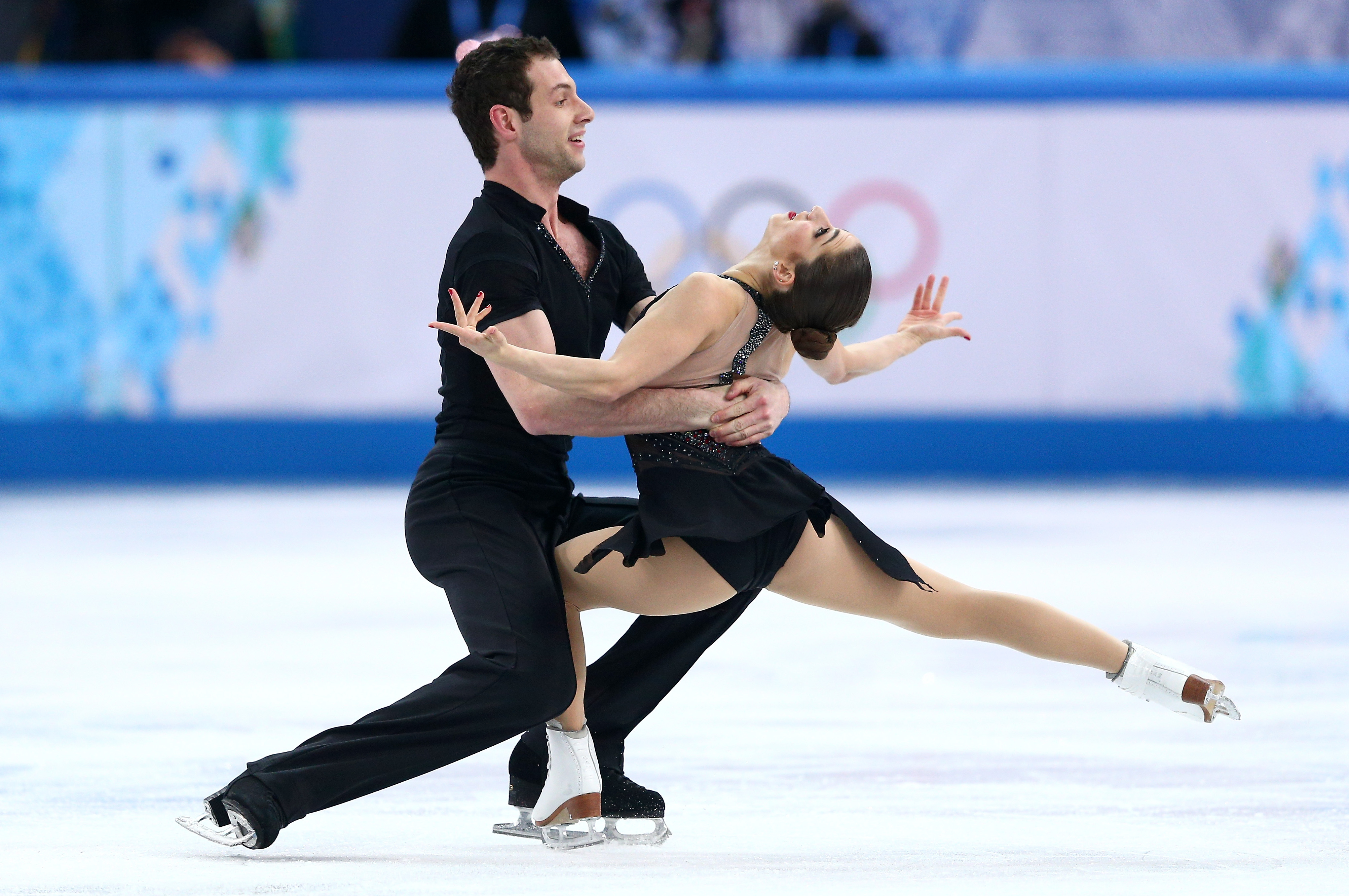 SOCHI, RUSSIA - FEBRUARY 06:  Marissa Castelli and Simon Shnapir of the United States compete in the Figure Skating Pairs Short Program during the Sochi 2014 Winter Olympics at Iceberg Skating Palace on February 6, 2014 in Sochi, Russia.  (Photo by Clive Mason/Getty Images)