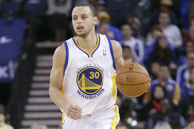 Golden State Warriors’ Stephen Curry (30) in action against the Charlotte Bobcats during an NBA basketball game in Oakland, Calif., Tuesday, Feb. 4, 2014. (AP Photo/Tony Avelar)