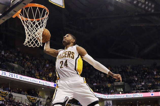 FILE - In this Jan. 18, 2014, file photo, Indiana Pacers forward Paul George (24) dunks in front of the Los Angeles Clippers Hedo Turkoglu (8) during the second half of an NBA basketball game in Indianapolis. Indiana's Paul George and Golden State's Stephen Curry could be first-time starters when the NBA announces the results of fan balloting for the All-Star game on Thursday, Jan. 23, 2013. (AP Photo/AJ Mast, File)