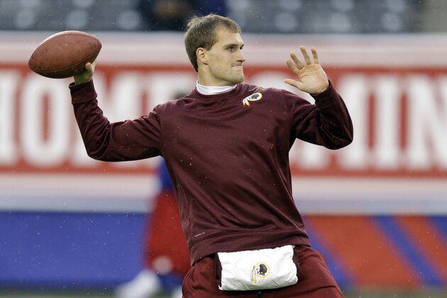 Washington Redskins quarterback Kirk Cousins warms up before an NFL football game against the New York Giants Sunday, Dec. 29, 2013, in East Rutherford, N.J.  (AP Photo/Julio Cortez)