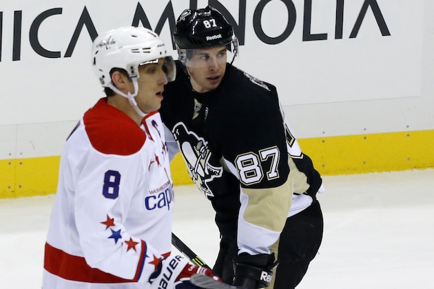 Pittsburgh Penguins' Sidney Crosby (87) and Washington Capitals' Alex Ovechkin (8) skate during an NHL hockey game between the Pittsburgh Penguins and the Washington Capitals in Pittsburgh, Wednesday, Jan. 15, 2014. The Penguins won 4-3.(AP Photo/Gene J. Puskar)