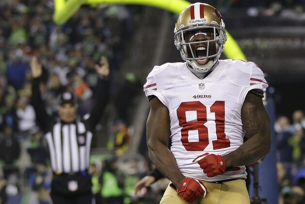 San Francisco 49ers' Anquan Boldin celebrates his touchdown catch during the second half of the NFL football NFC Championship game against the Seattle Seahawks Sunday, Jan. 19, 2014, in Seattle. (AP Photo/Marcio Jose Sanchez)