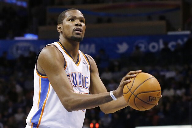 Oklahoma City Thunder forward Kevin Durant (35) shoots a foul shot against the Minnesota Timberwolves in the third quarter of an NBA basketball game in Oklahoma City, Wednesday, Feb. 5, 2014. Oklahoma City won 106-97. (AP Photo/Sue Ogrocki)