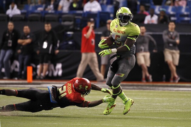 Jan 2, 2014; St. Petersburg, FL, USA;  Team Nitro cornerback Jabrill Peppers (5) runs with the ball as Team Hightlight cornerback  Adoree Jackson (21) defends during the second half at Tropicana Field. Team Highlight defeated the Team Nitro 31-21. Mandatory Credit: Kim Klement-USA TODAY Sports